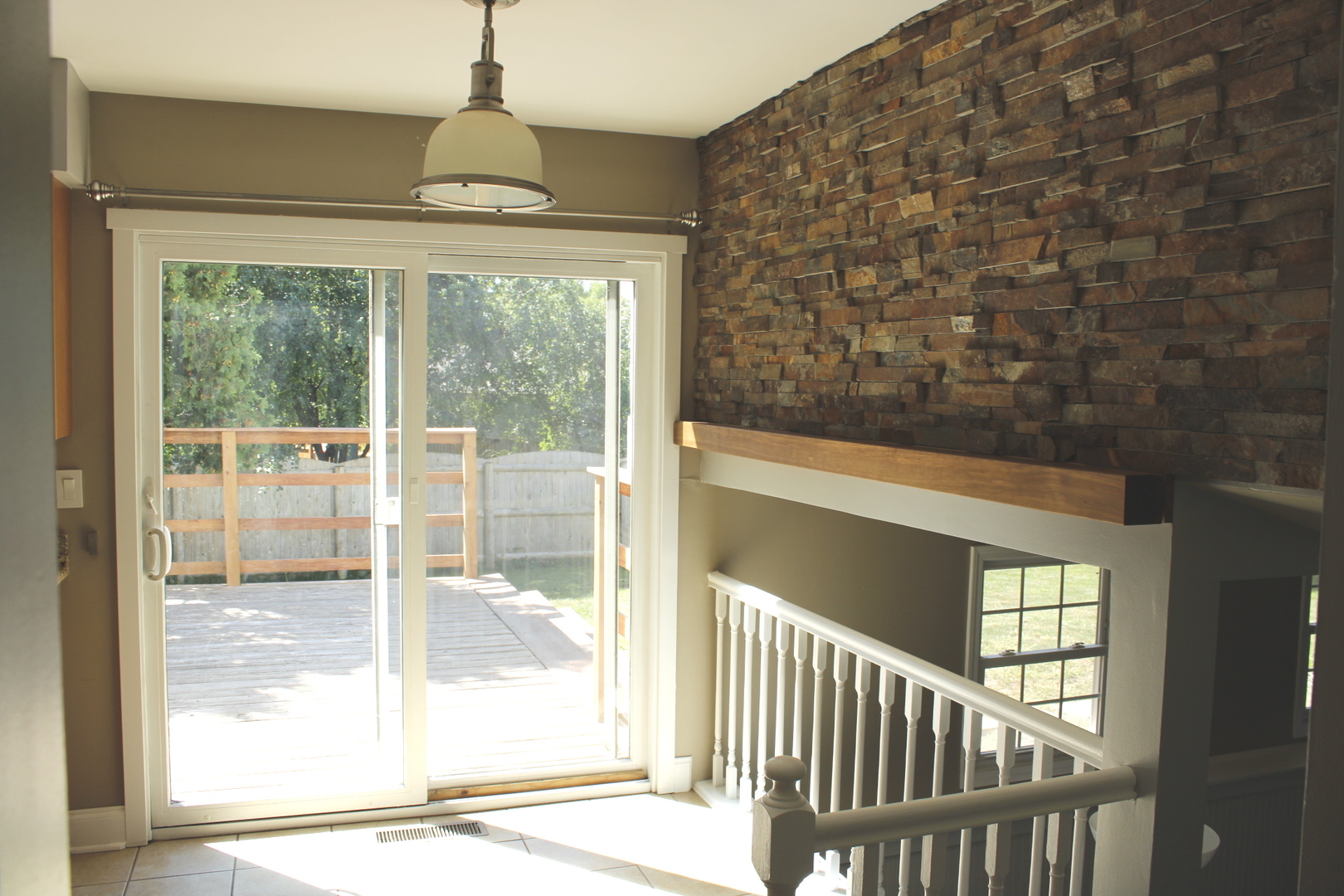 366 Cedarbrook Road Naperville, IL 60565 - Photo 8 of 20 a view of a porch with a floor to ceiling window