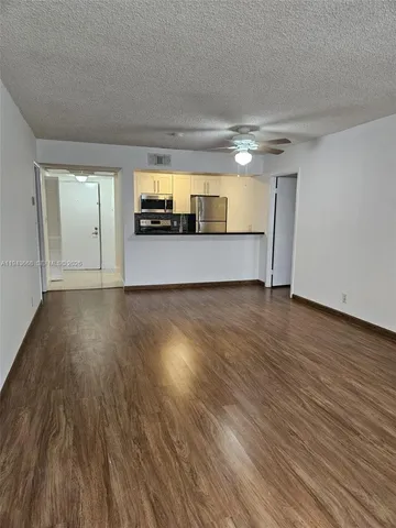a view of a livingroom with wooden floor