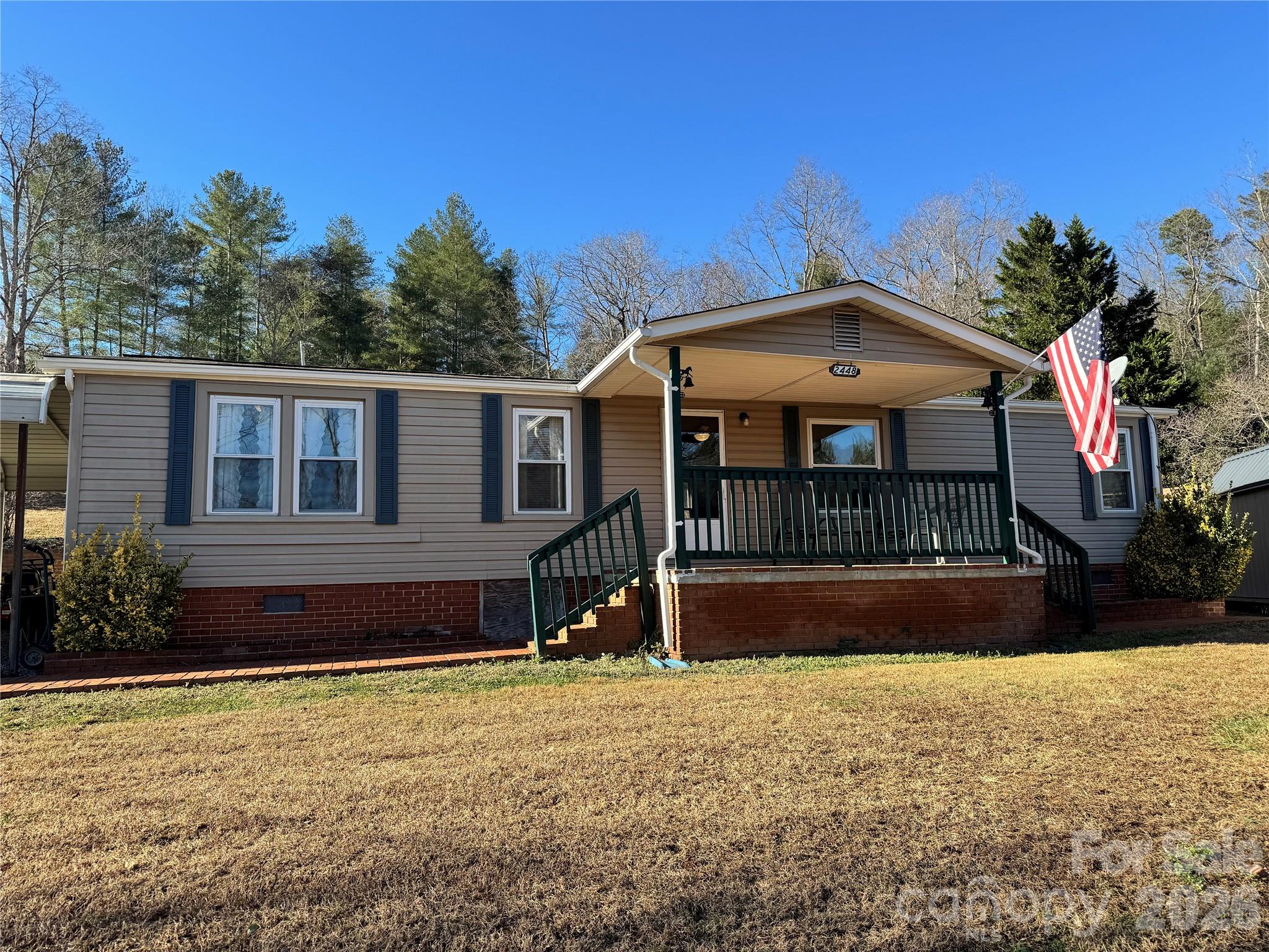 2448 Christopher Road Morganton, NC 28655 - Photo 1 of 32 a front view of a house with a yard