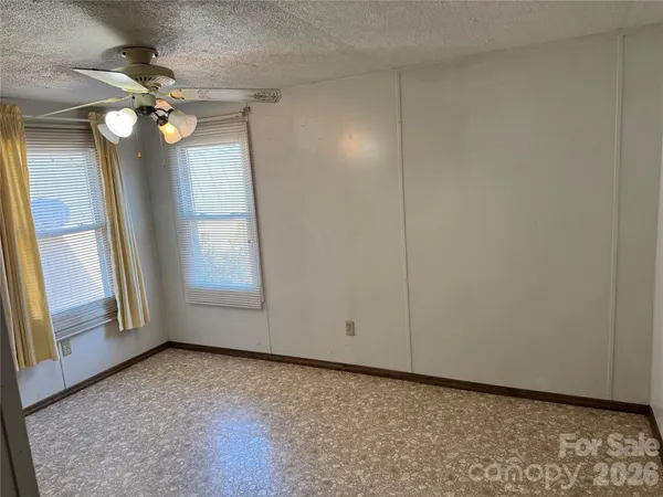 a bathroom with a toilet a sink and a mirror
