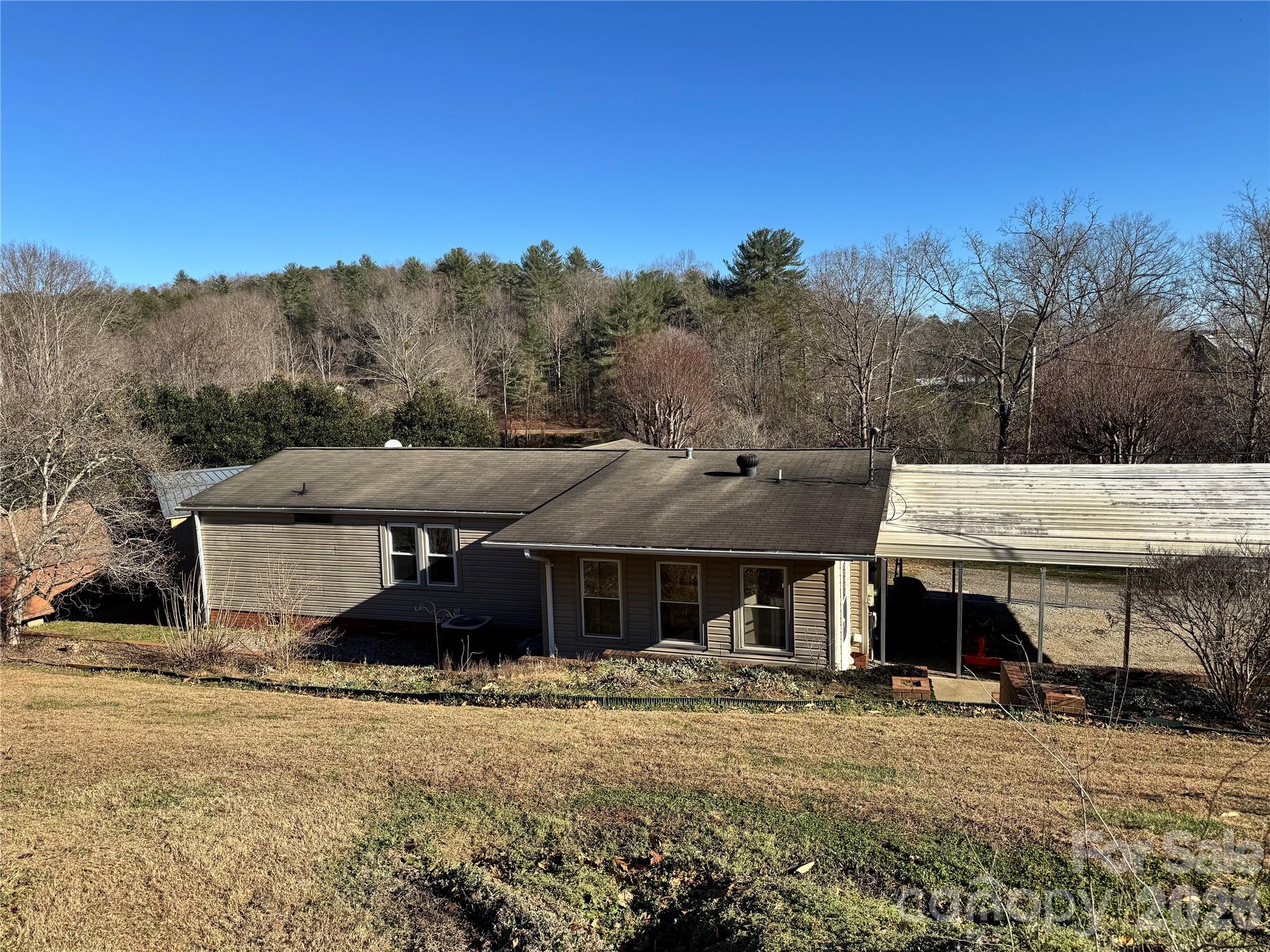 2448 Christopher Road Morganton, NC 28655 - Photo 18 of 32 a front view of a house with a yard