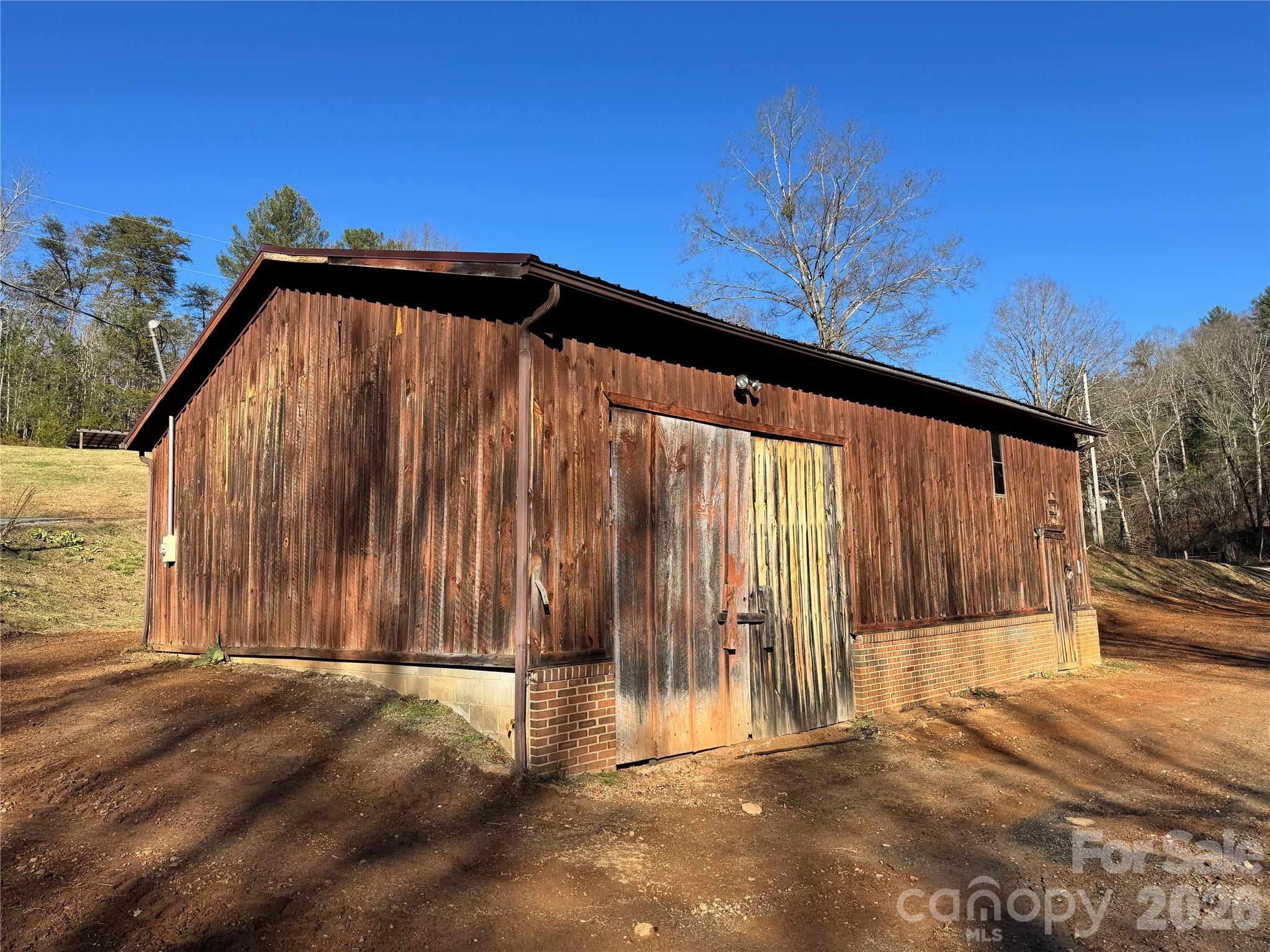 2448 Christopher Road Morganton, NC 28655 - Photo 26 of 32 a view of a back yard with an outdoor space
