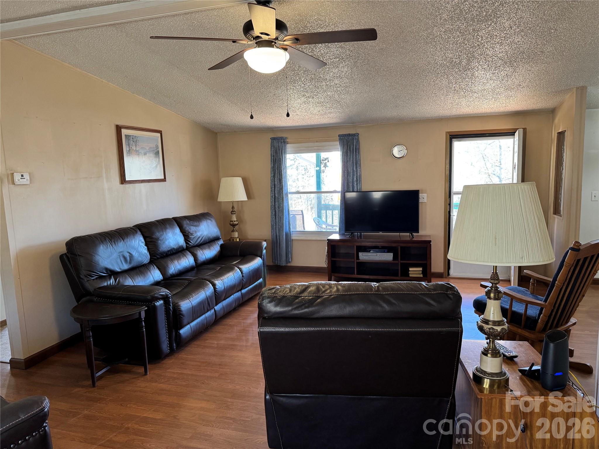 2448 Christopher Road Morganton, NC 28655 - Photo 4 of 32 a living room with furniture and a flat screen tv