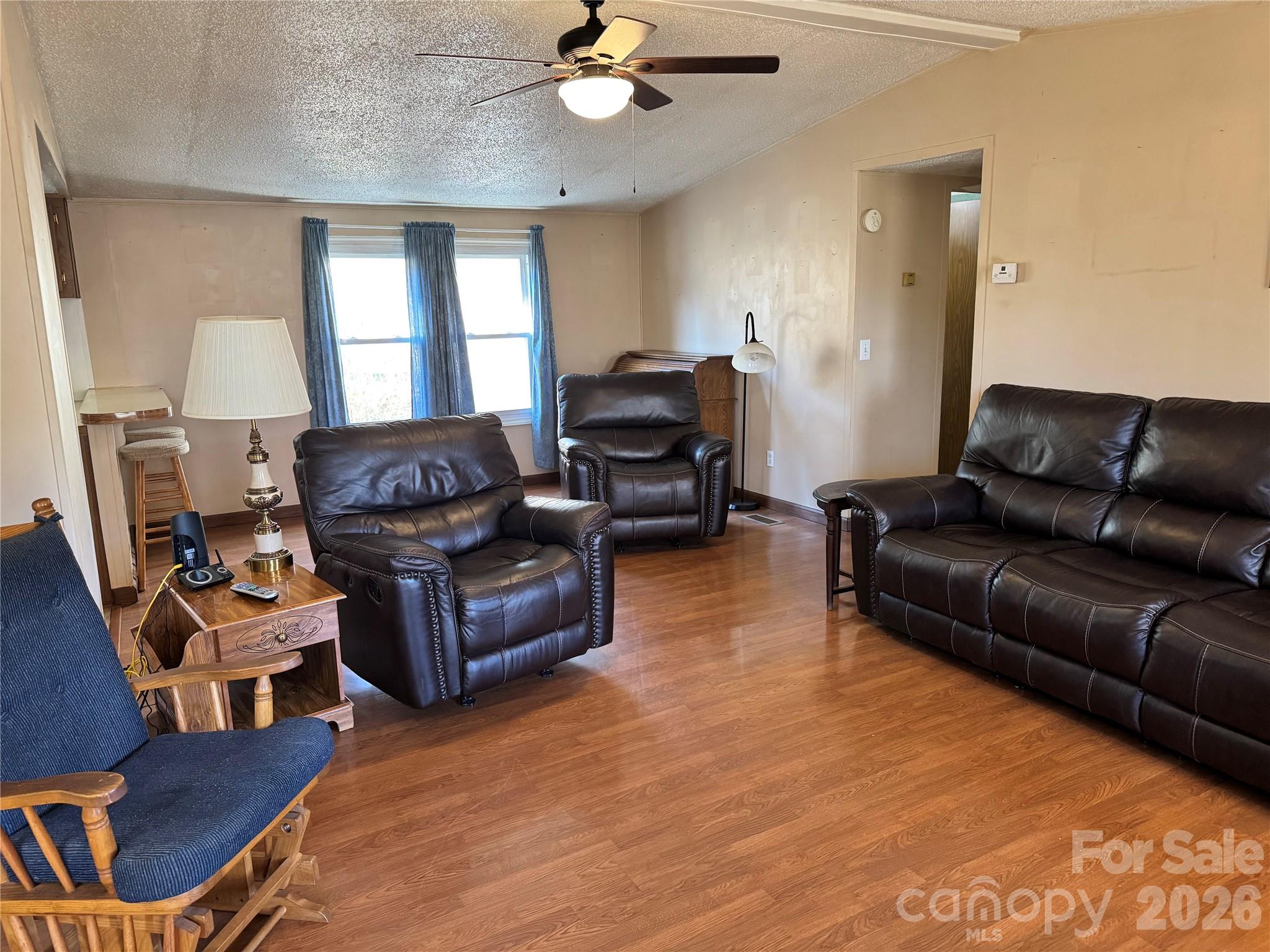2448 Christopher Road Morganton, NC 28655 - Photo 5 of 32 a living room with furniture and a wooden floor
