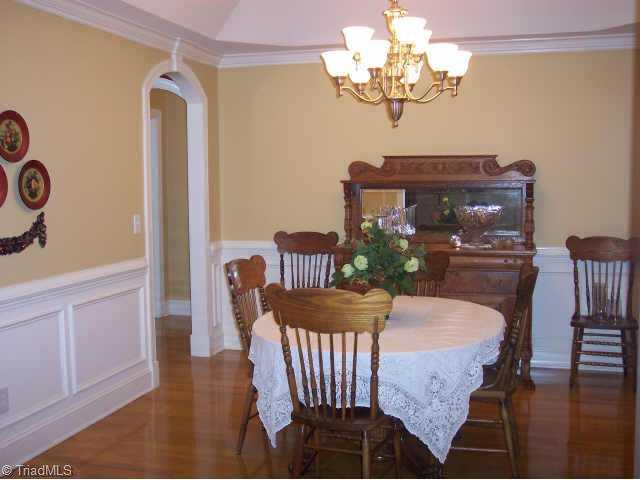 8211 Kelly Ford Road Oak Ridge, NC 27310 - Photo 6 of 9 Other. Formal dining room with arched doorways, trey ceiling and exquisite moldings.