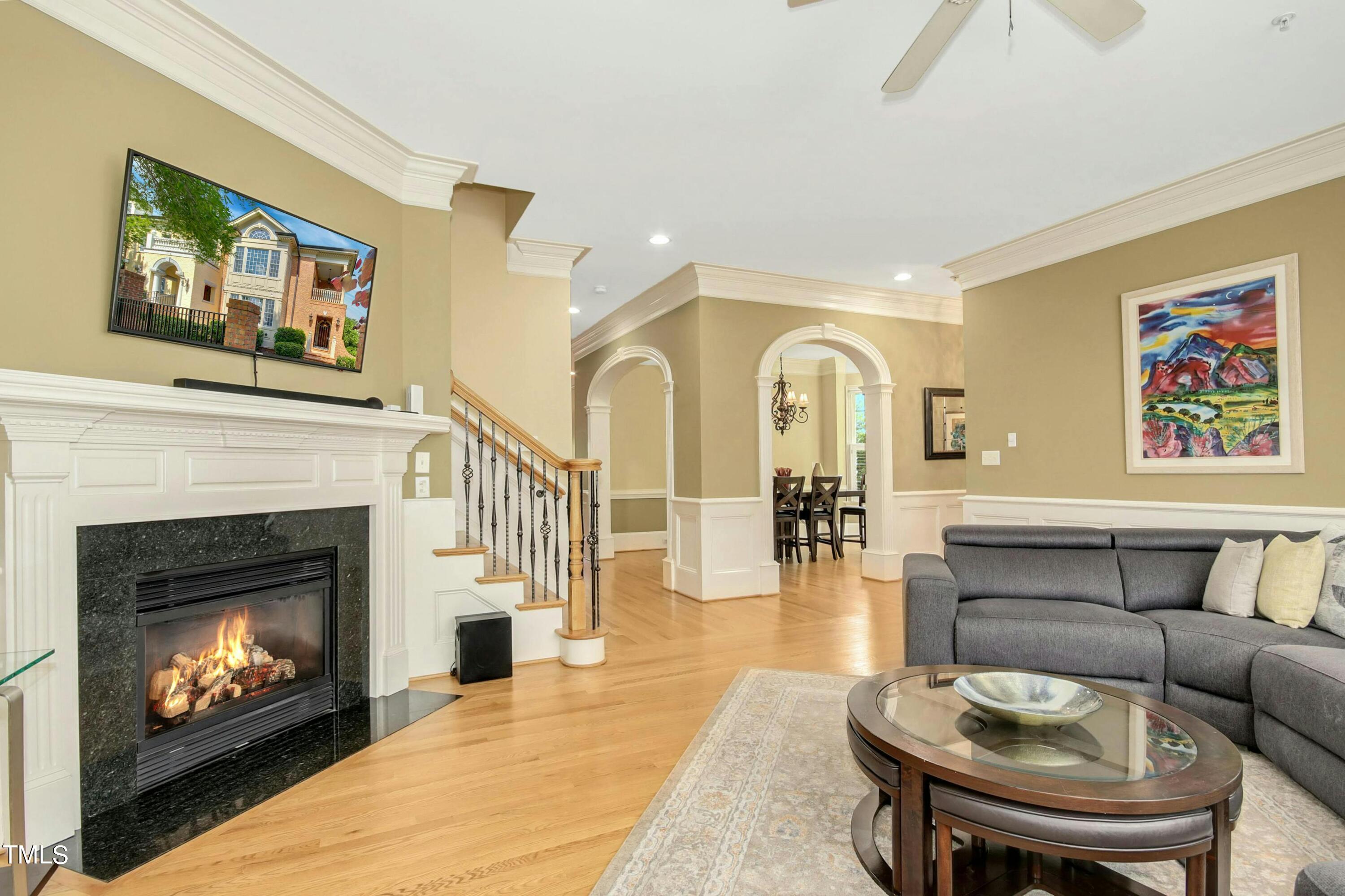 212 West Barbee Chapel Road Chapel Hill, NC 27517 - Photo 18 of 75 a living room with furniture a fireplace and wall paintings