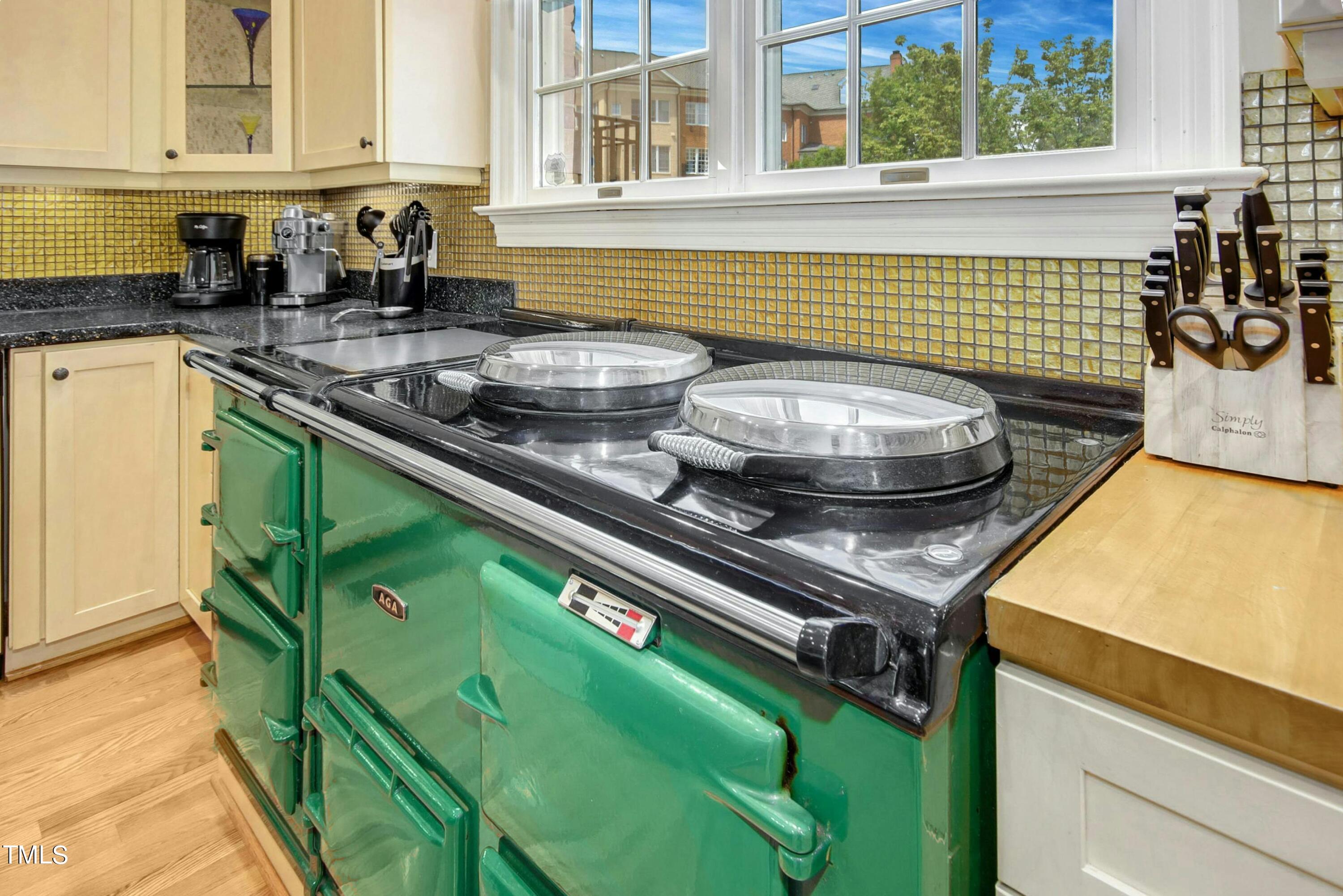 212 West Barbee Chapel Road Chapel Hill, NC 27517 - Photo 24 of 75 a kitchen with a stove and a sink