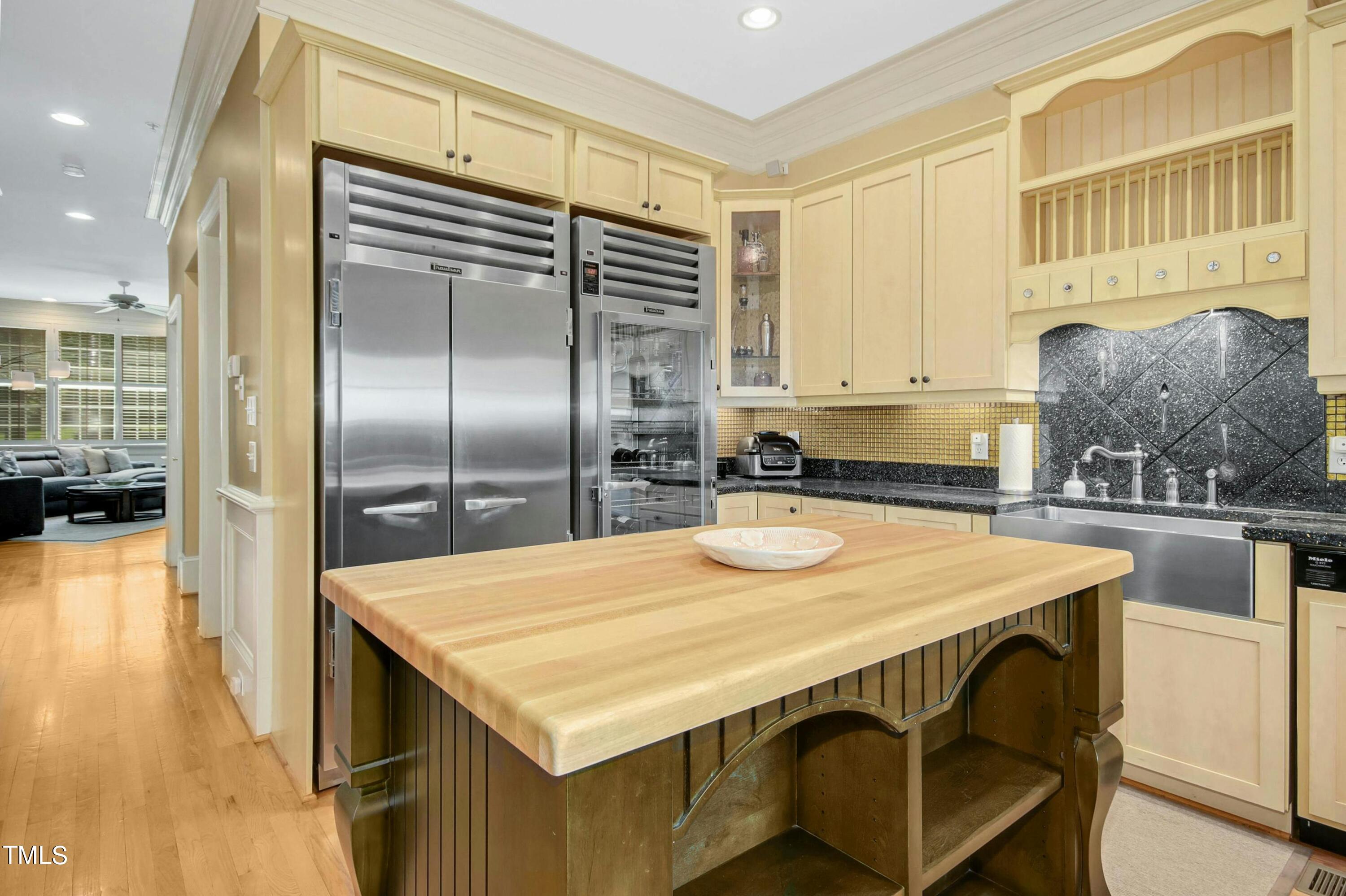 212 West Barbee Chapel Road Chapel Hill, NC 27517 - Photo 25 of 75 a kitchen with kitchen island a sink appliances and cabinets