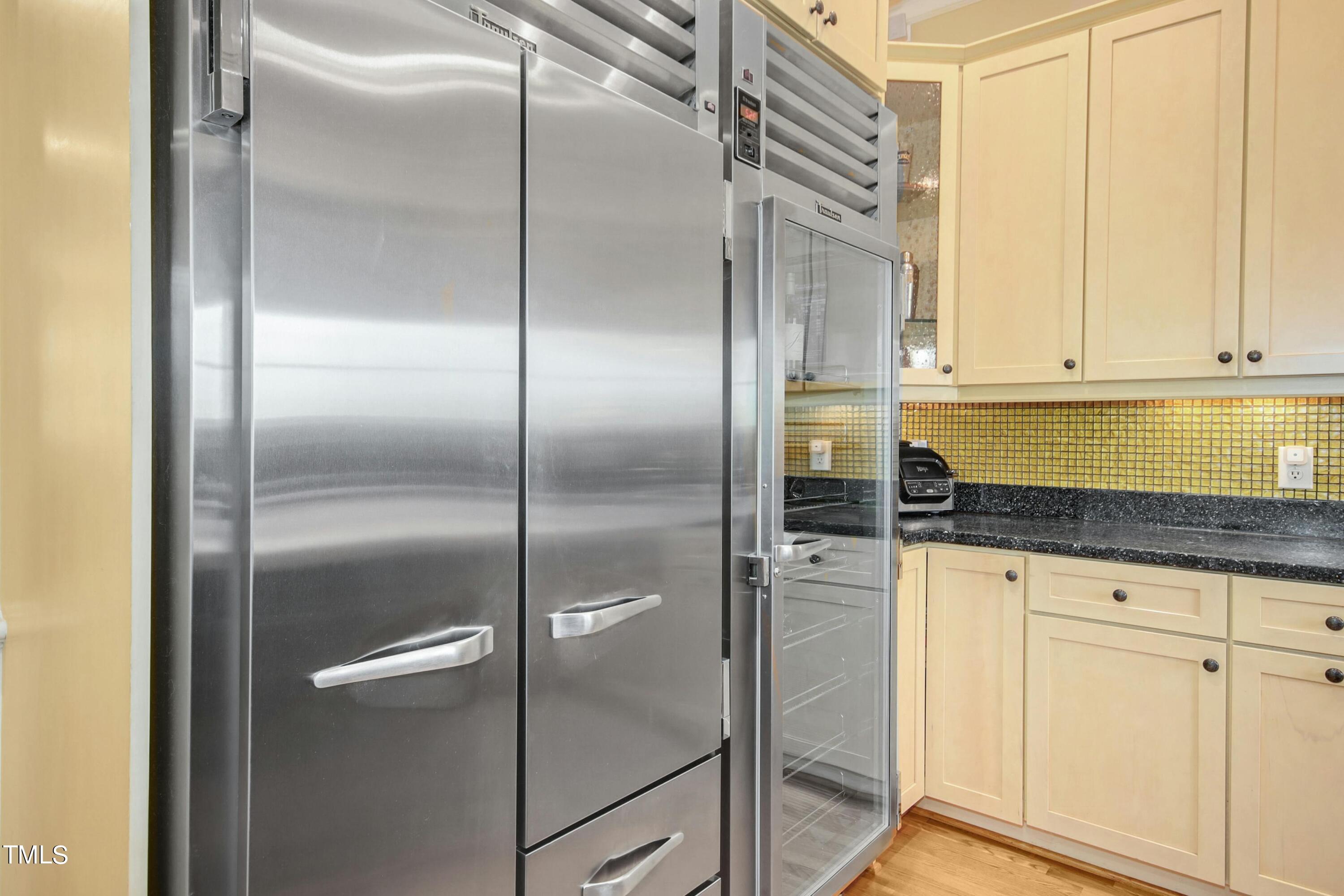 212 West Barbee Chapel Road Chapel Hill, NC 27517 - Photo 27 of 75 a kitchen with white cabinets and a refrigerator