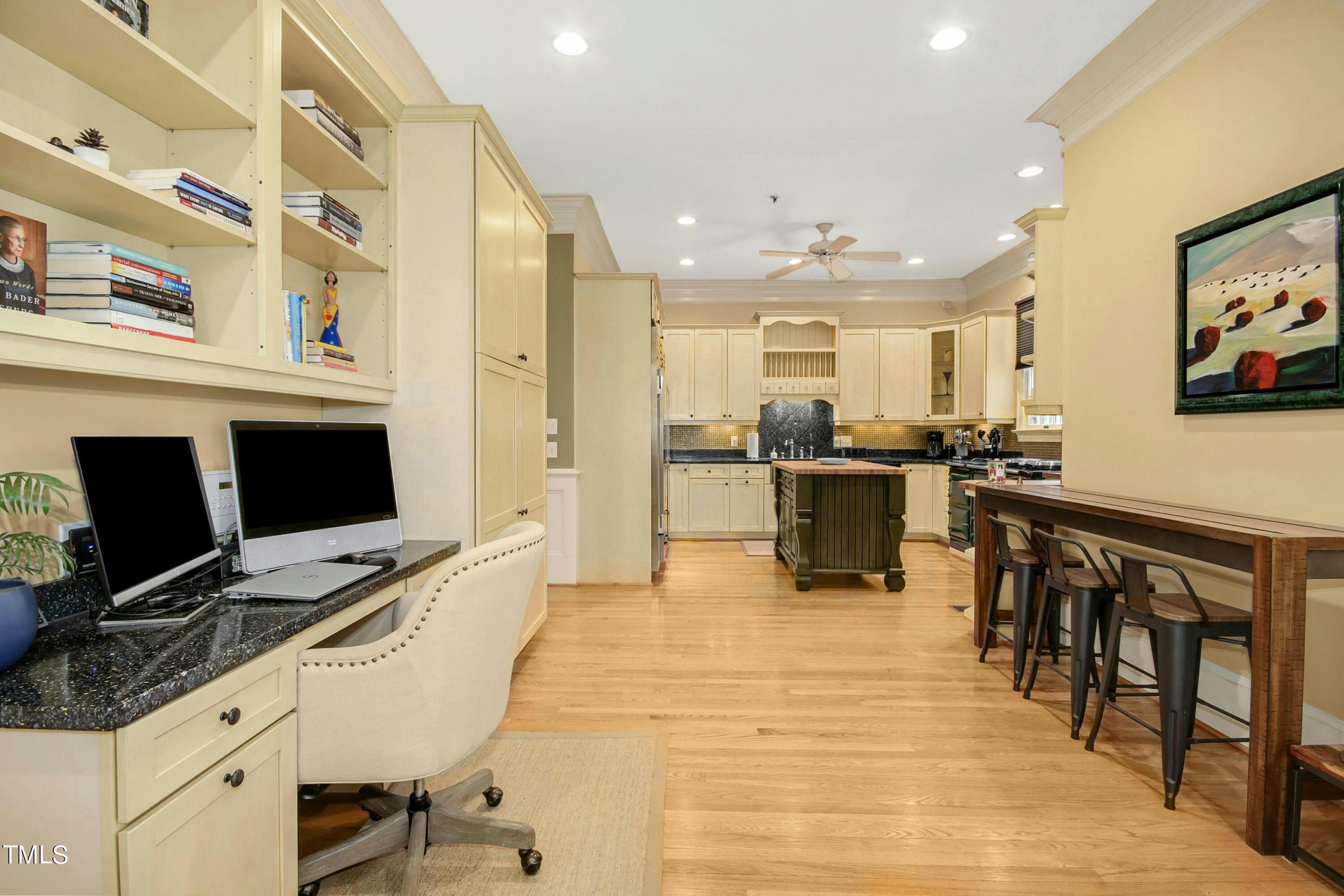 212 West Barbee Chapel Road Chapel Hill, NC 27517 - Photo 28 of 75 a kitchen with stainless steel appliances kitchen island granite countertop a table and chairs in it