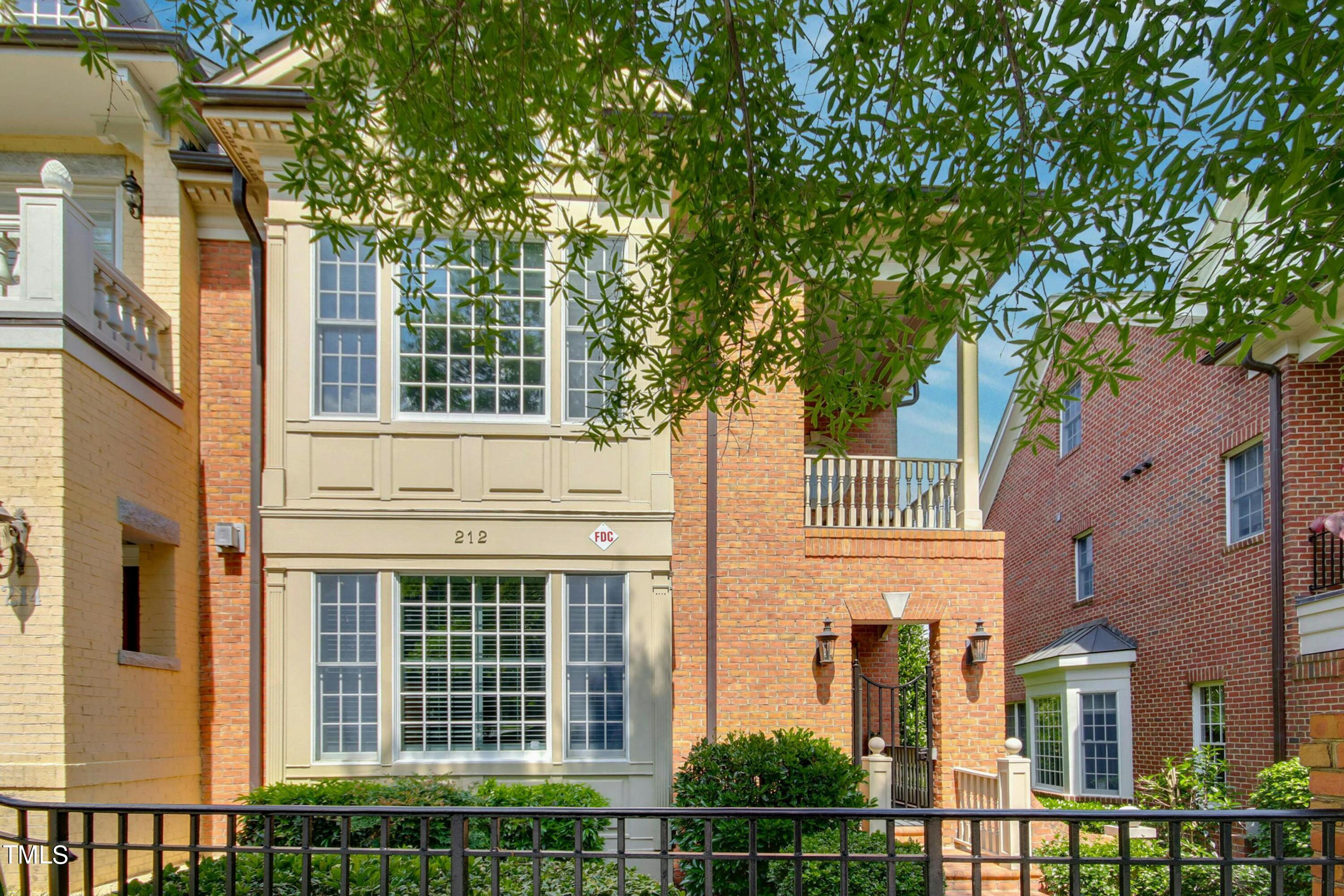 212 West Barbee Chapel Road Chapel Hill, NC 27517 - Photo 3 of 75 front view of a brick house with large windows