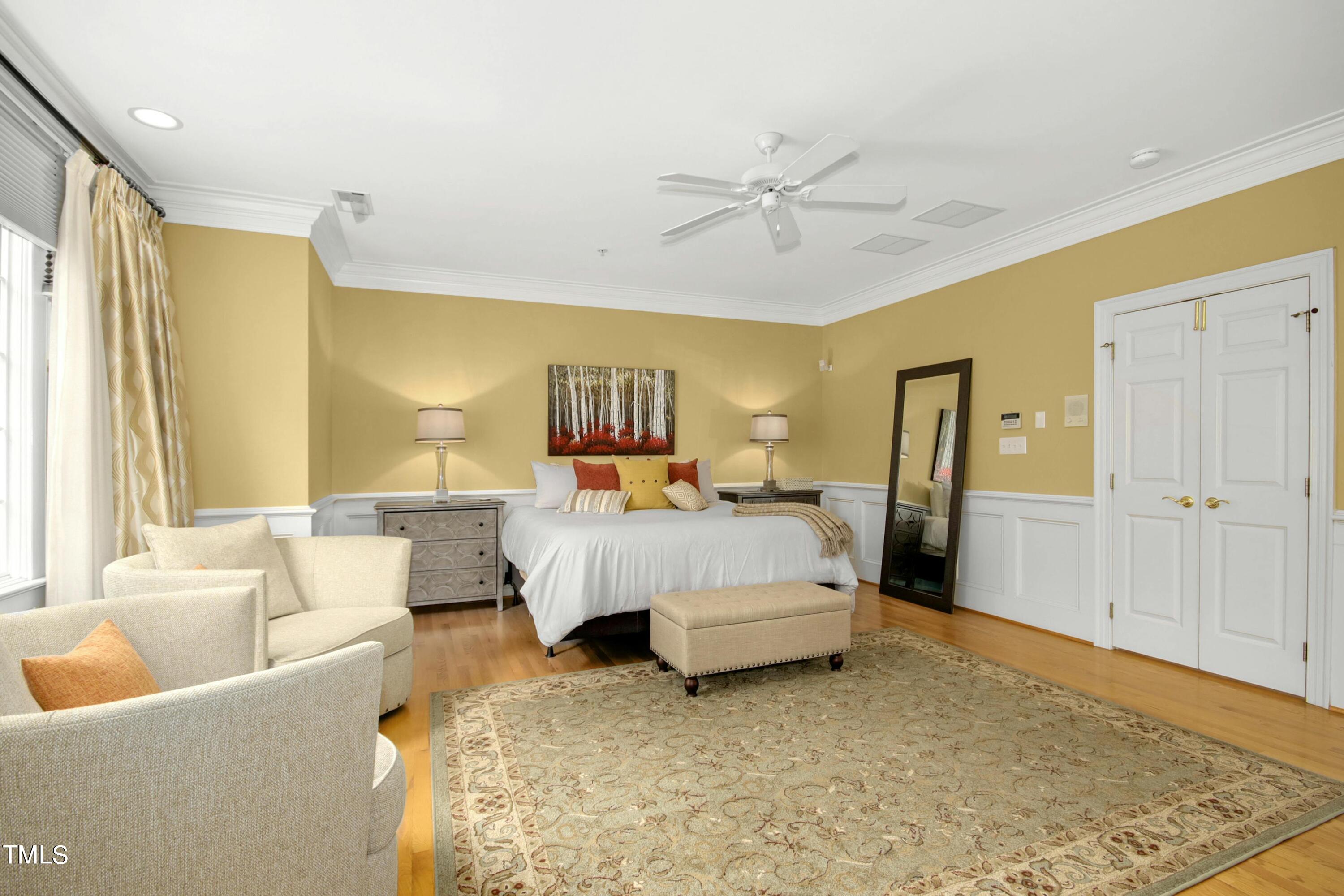 212 West Barbee Chapel Road Chapel Hill, NC 27517 - Photo 38 of 75 a bed room with a bed and a couch