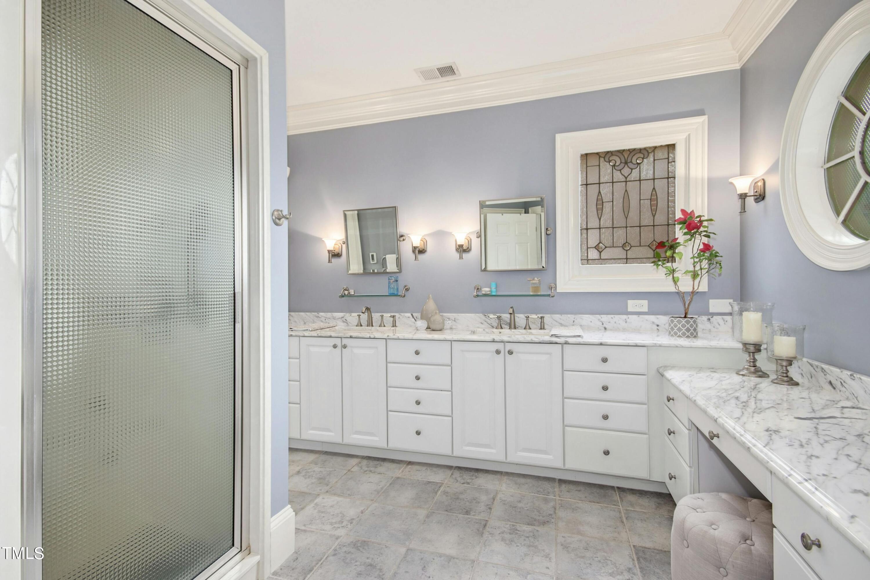 212 West Barbee Chapel Road Chapel Hill, NC 27517 - Photo 41 of 75 a bathroom with a granite countertop sink mirror and a