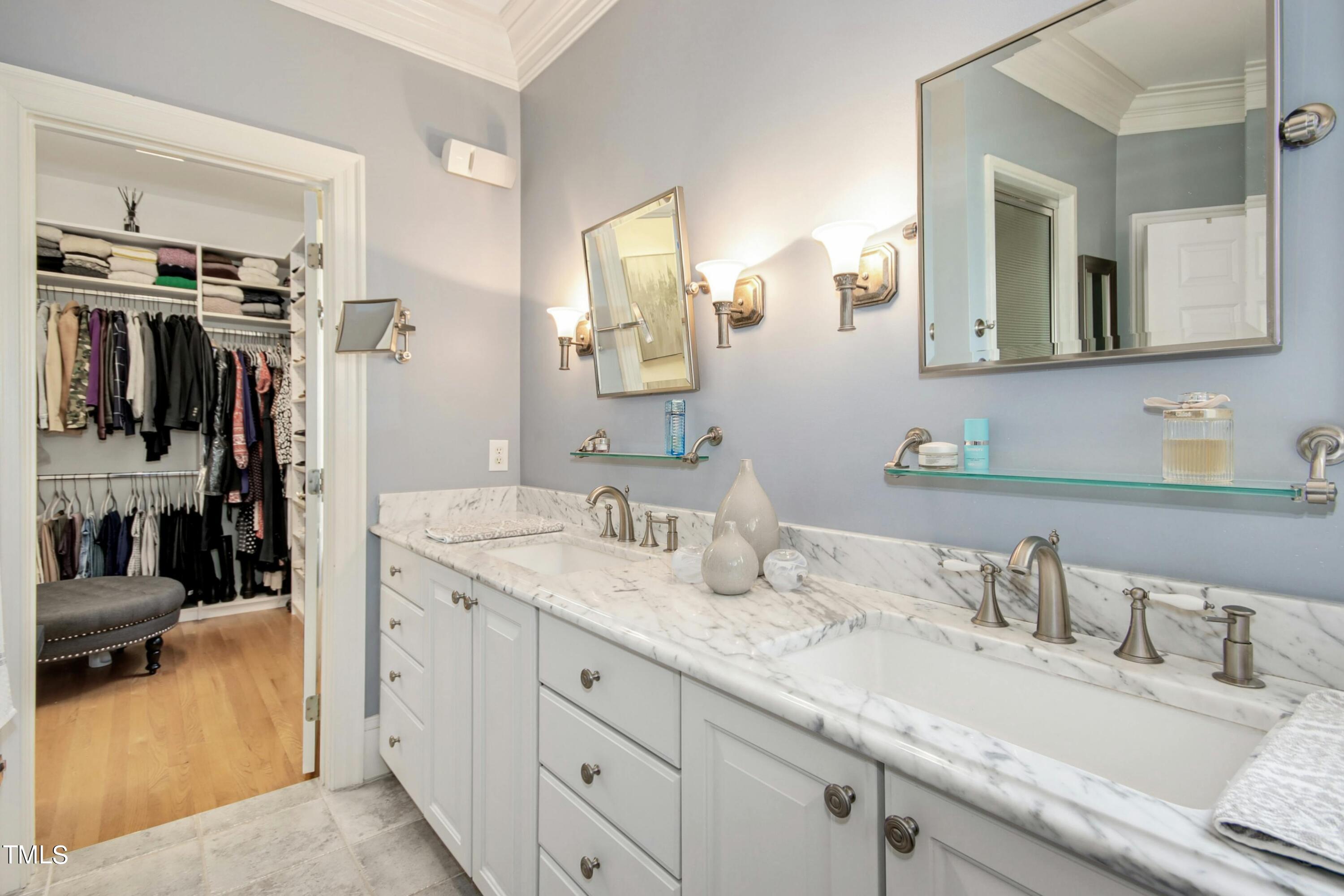 212 West Barbee Chapel Road Chapel Hill, NC 27517 - Photo 43 of 75 a en suite bathroom with a granite countertop sink and a mirror