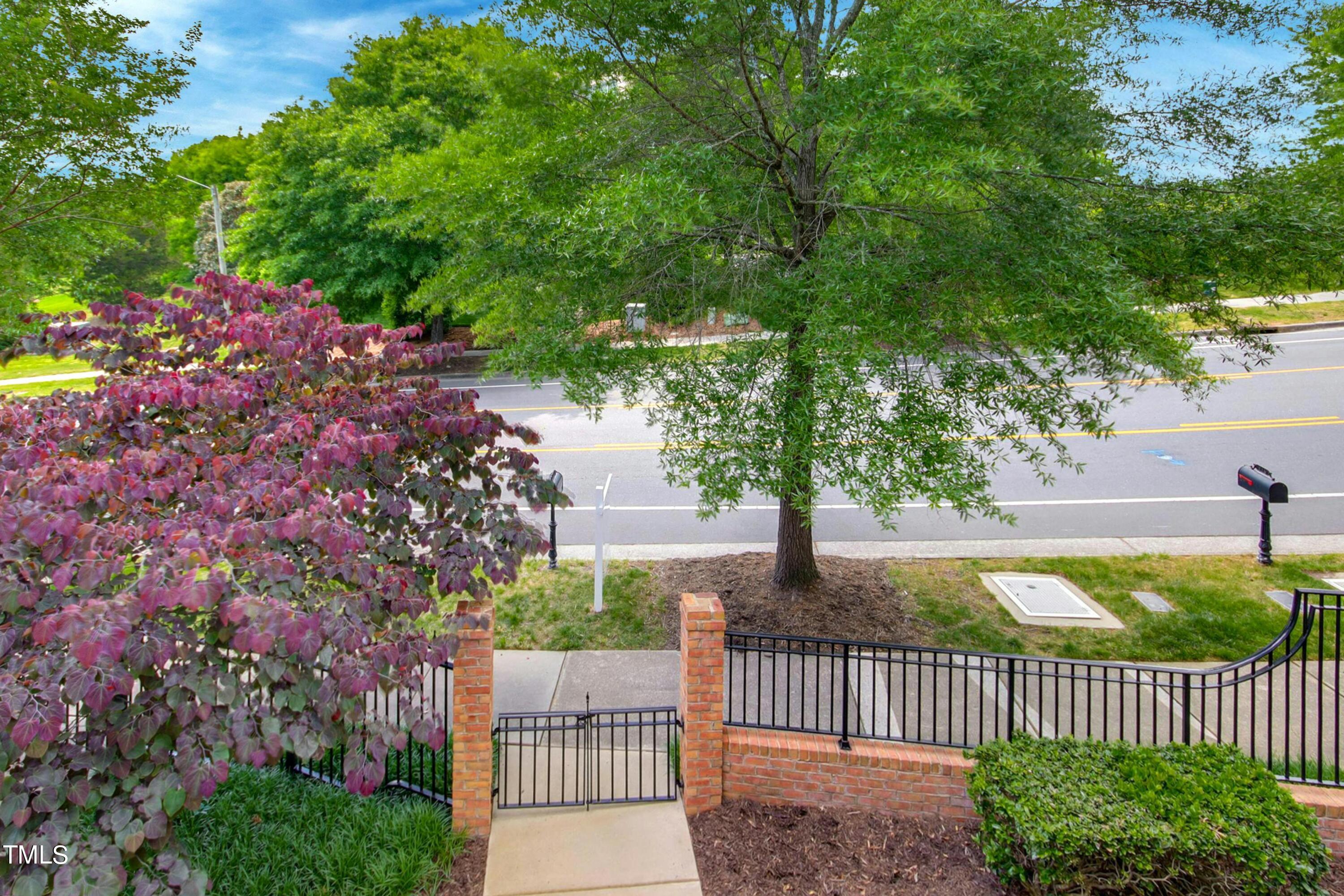 212 West Barbee Chapel Road Chapel Hill, NC 27517 - Photo 48 of 75 a view of a house with a small yard and wooden fence