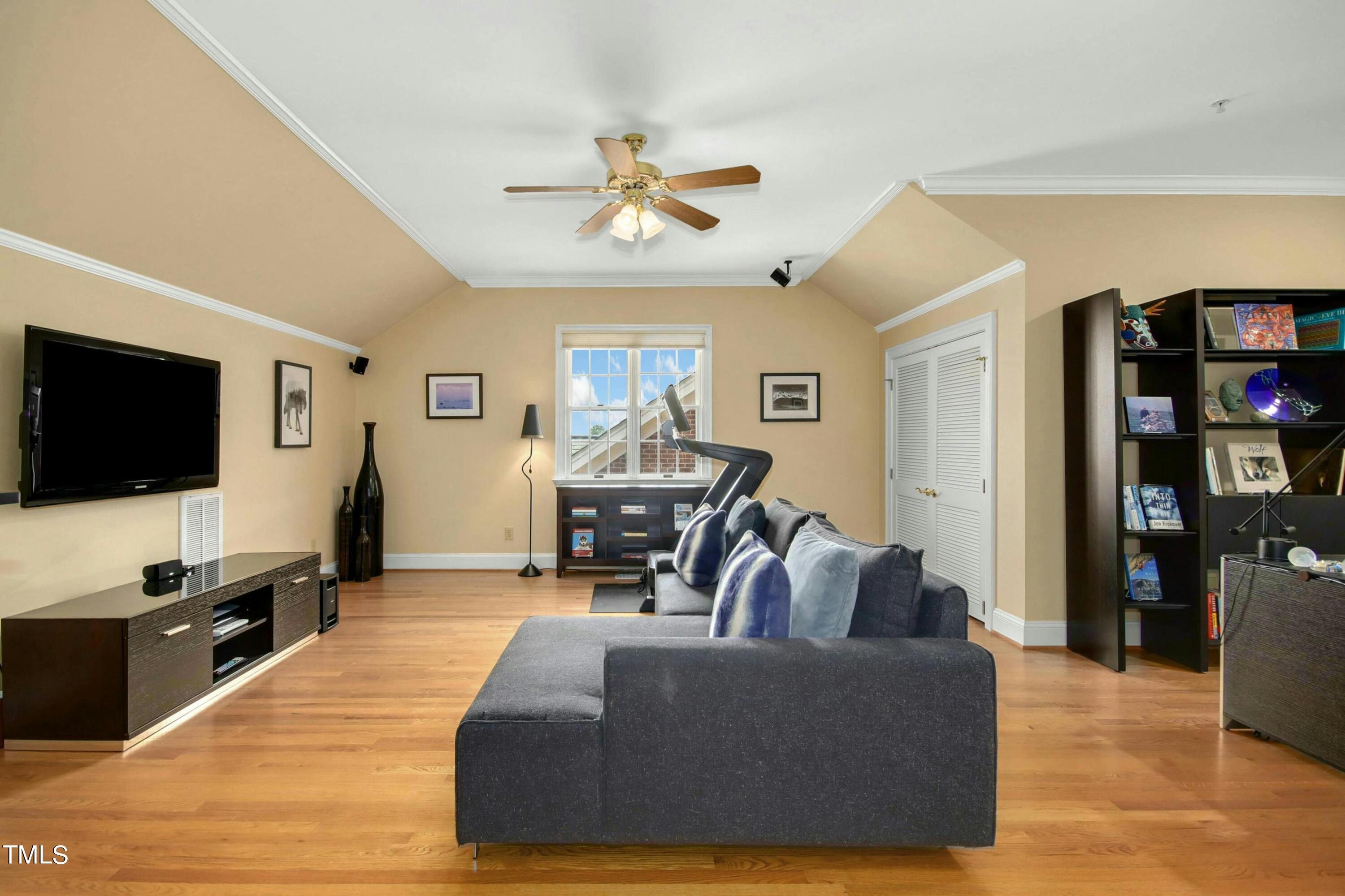 212 West Barbee Chapel Road Chapel Hill, NC 27517 - Photo 52 of 75 a living room with furniture and a flat screen tv