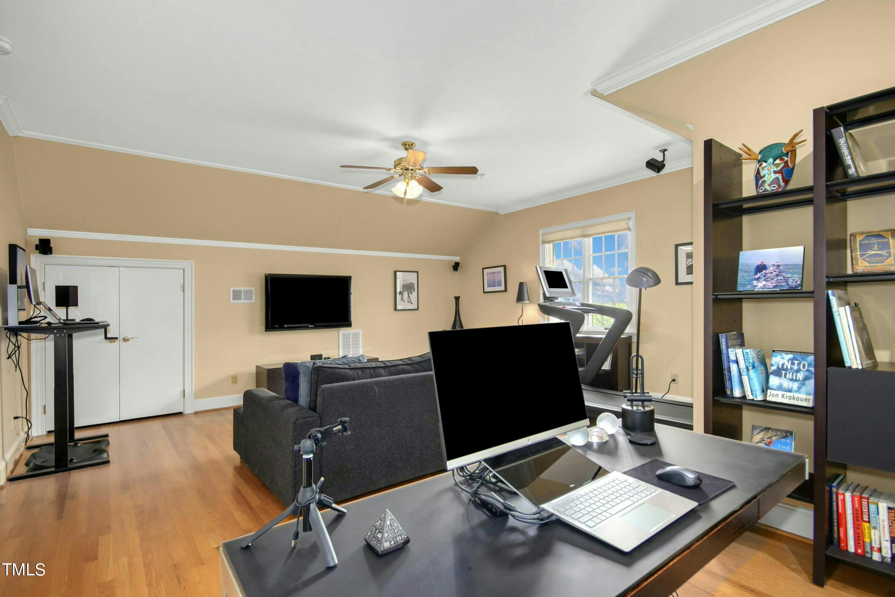 212 West Barbee Chapel Road Chapel Hill, NC 27517 - Photo 54 of 75 a workspace with furniture and a flat screen tv