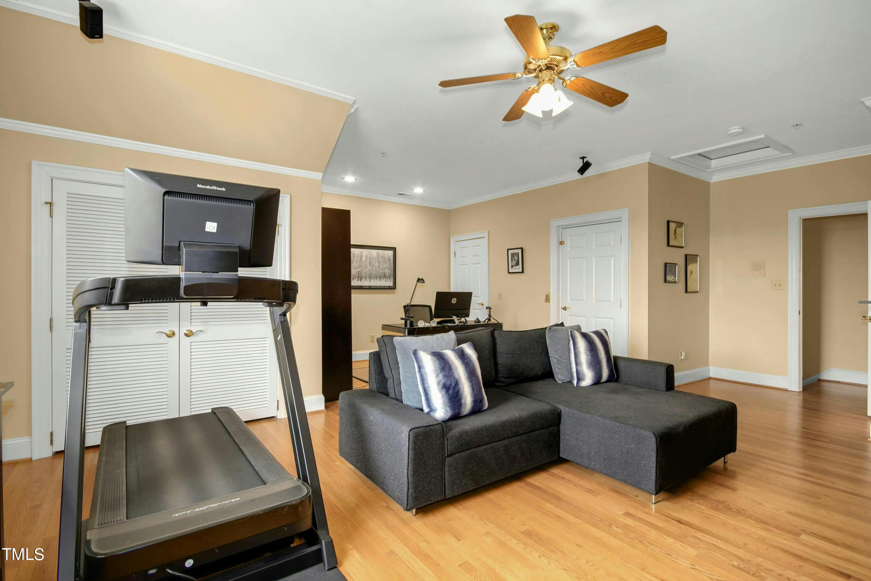 212 West Barbee Chapel Road Chapel Hill, NC 27517 - Photo 55 of 75 a living room with furniture and a flat screen tv