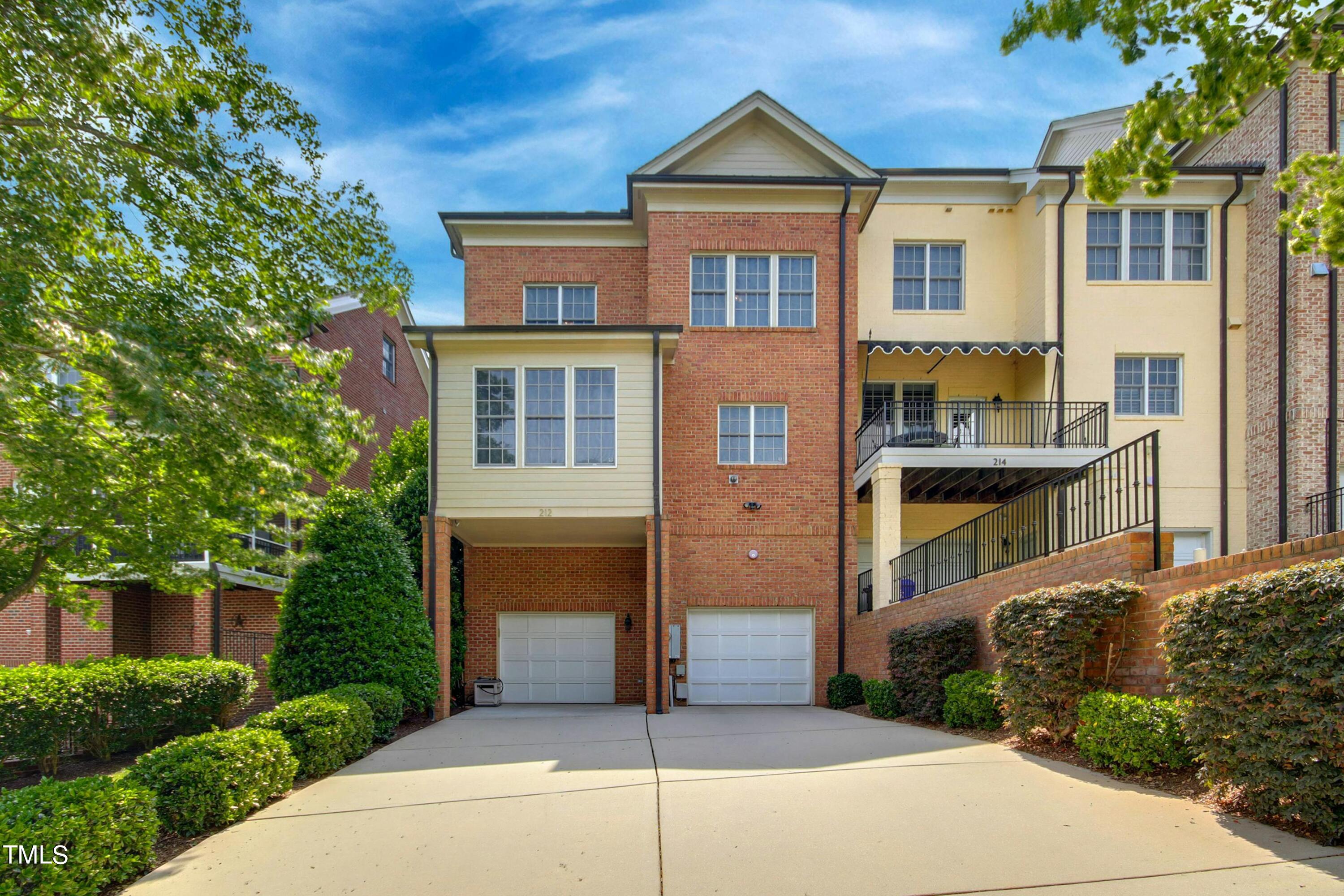 212 West Barbee Chapel Road Chapel Hill, NC 27517 - Photo 62 of 75 a front view of a house with a garden