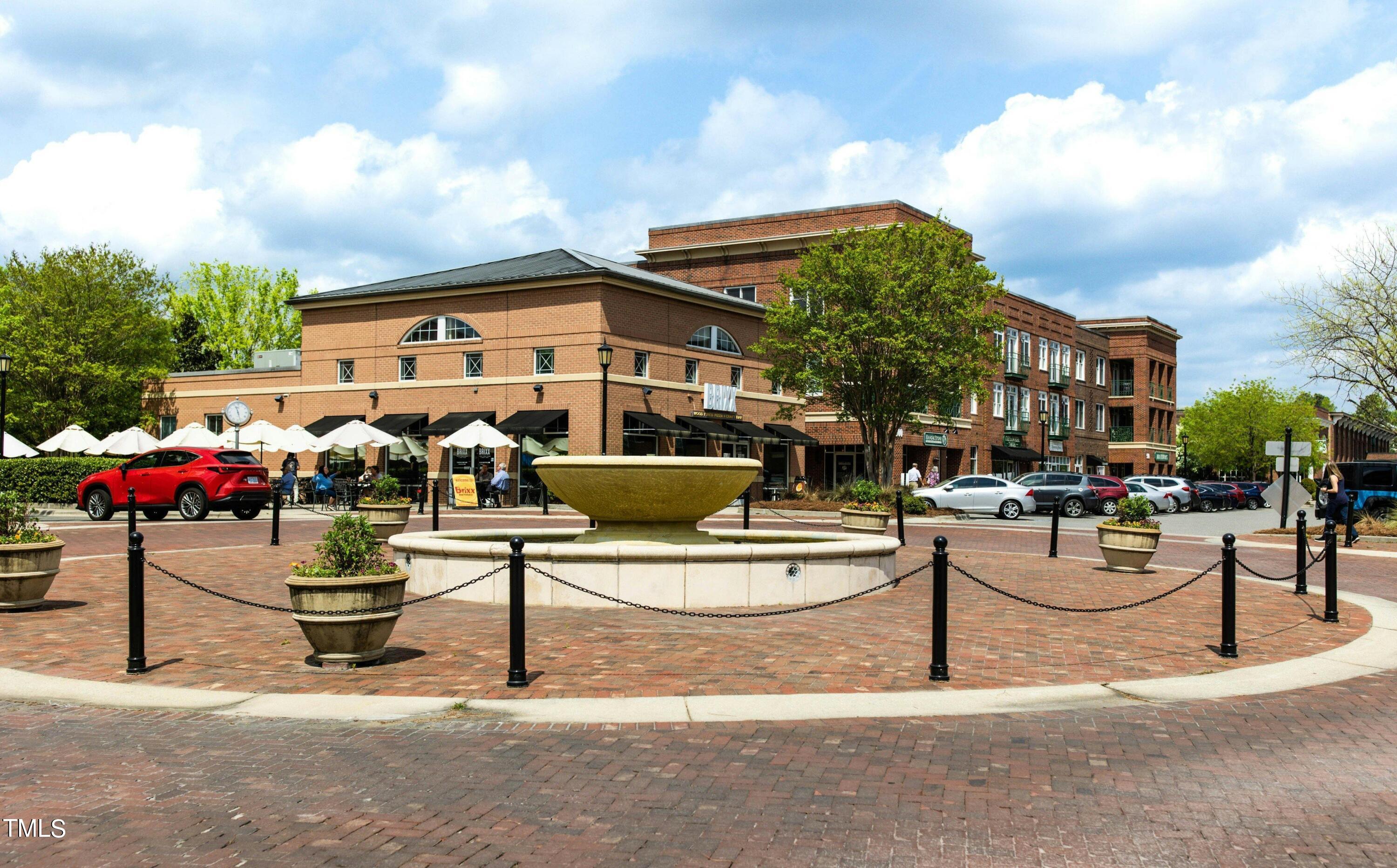 212 West Barbee Chapel Road Chapel Hill, NC 27517 - Photo 64 of 75 a view of a patio with couches and table and chairs and potted plants