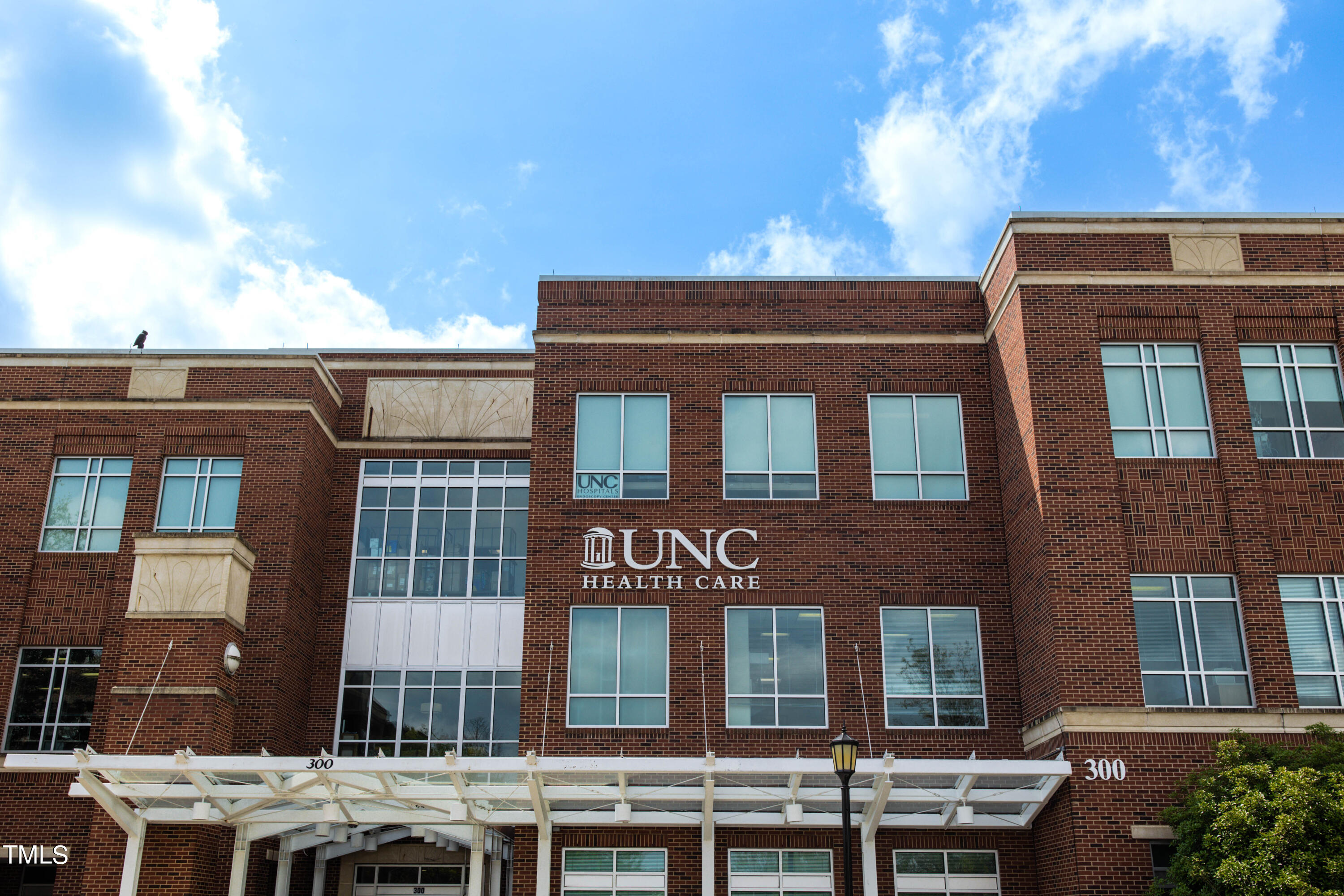 212 West Barbee Chapel Road Chapel Hill, NC 27517 - Photo 74 of 75 a view of a building with a yard