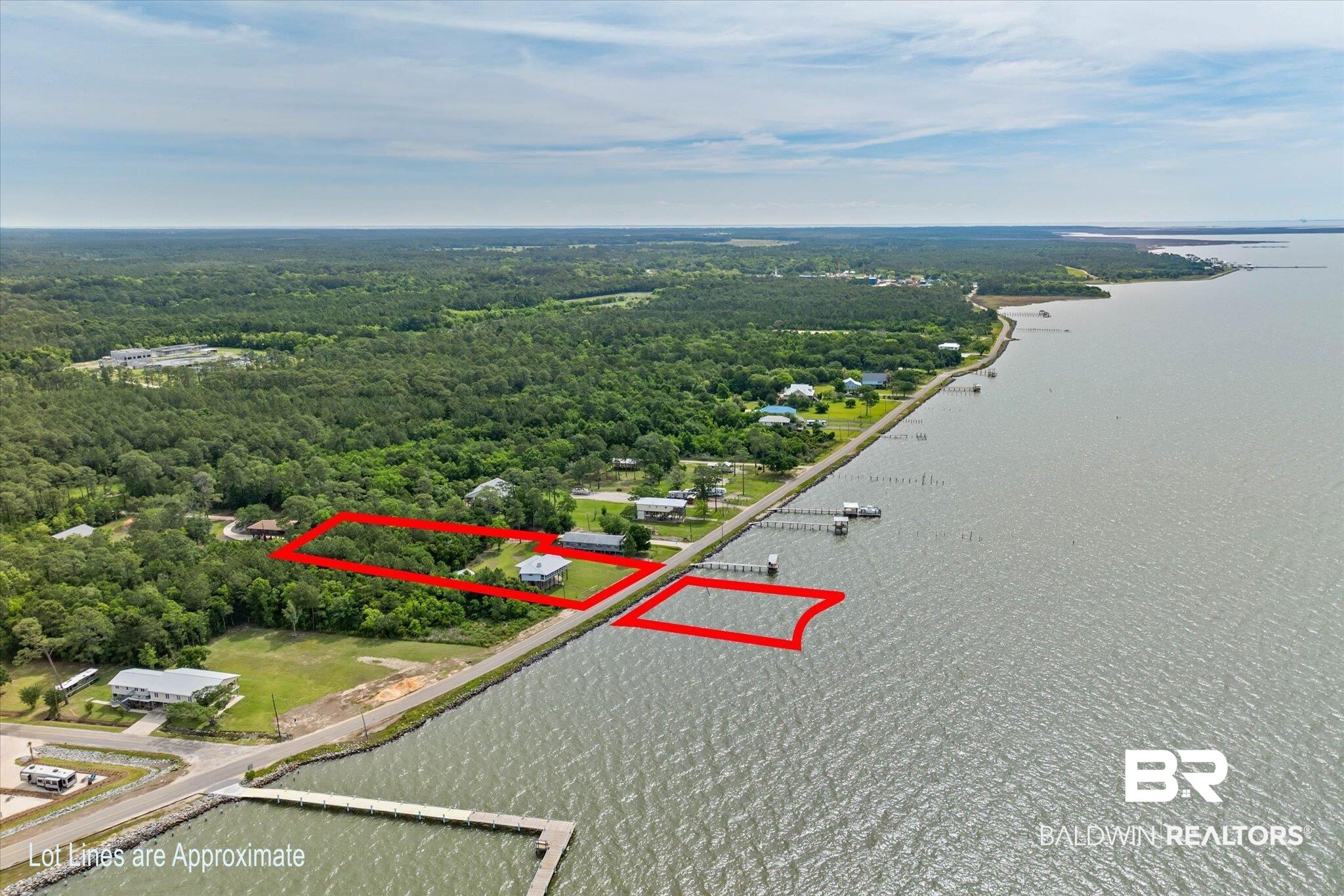 9100 Shell Belt Road Coden, AL 36523 - Photo 27 of 38 Aerial perspective showcasing a waterfront lot with surrounding natural woodlands