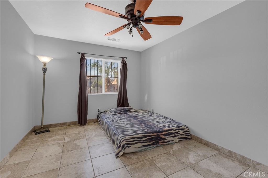 48734 Chichen Itza Road Coachella, CA 92236 - Photo 12 of 18 a bedroom with a bed and a window