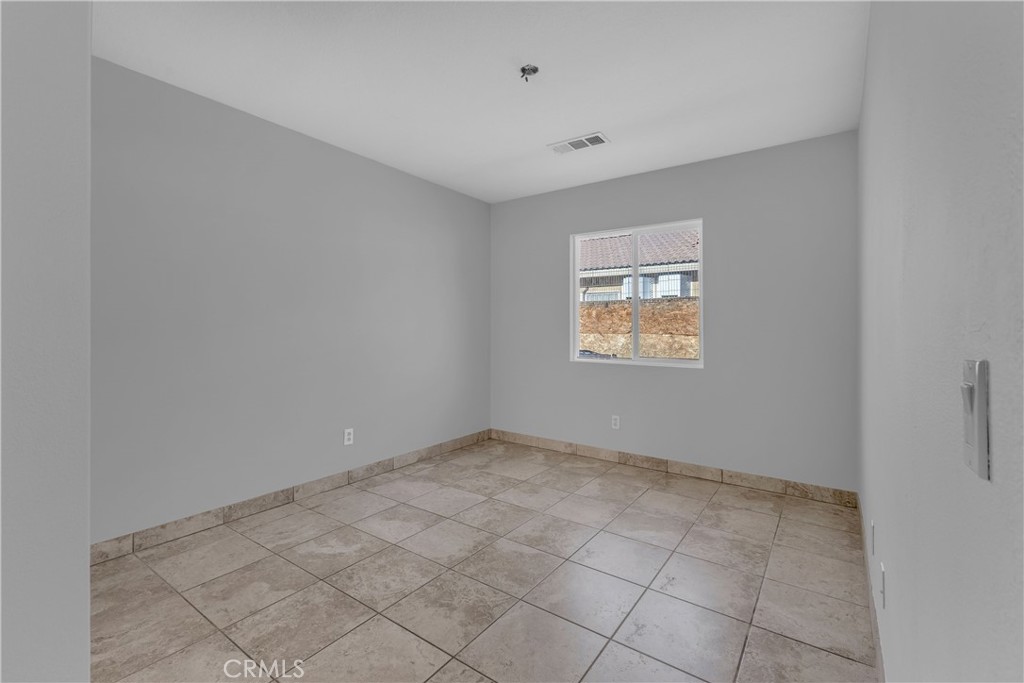 48734 Chichen Itza Road Coachella, CA 92236 - Photo 14 of 18 an empty room with windows