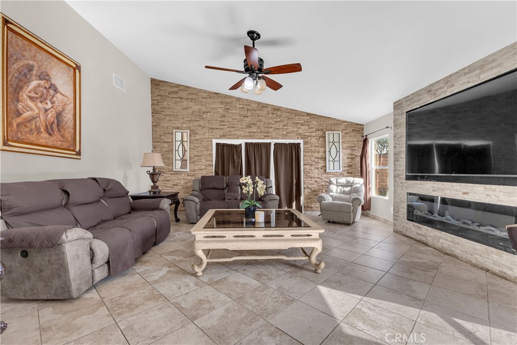 48734 Chichen Itza Road Coachella, CA 92236 - Photo 5 of 18 a living room with furniture and a flat screen tv