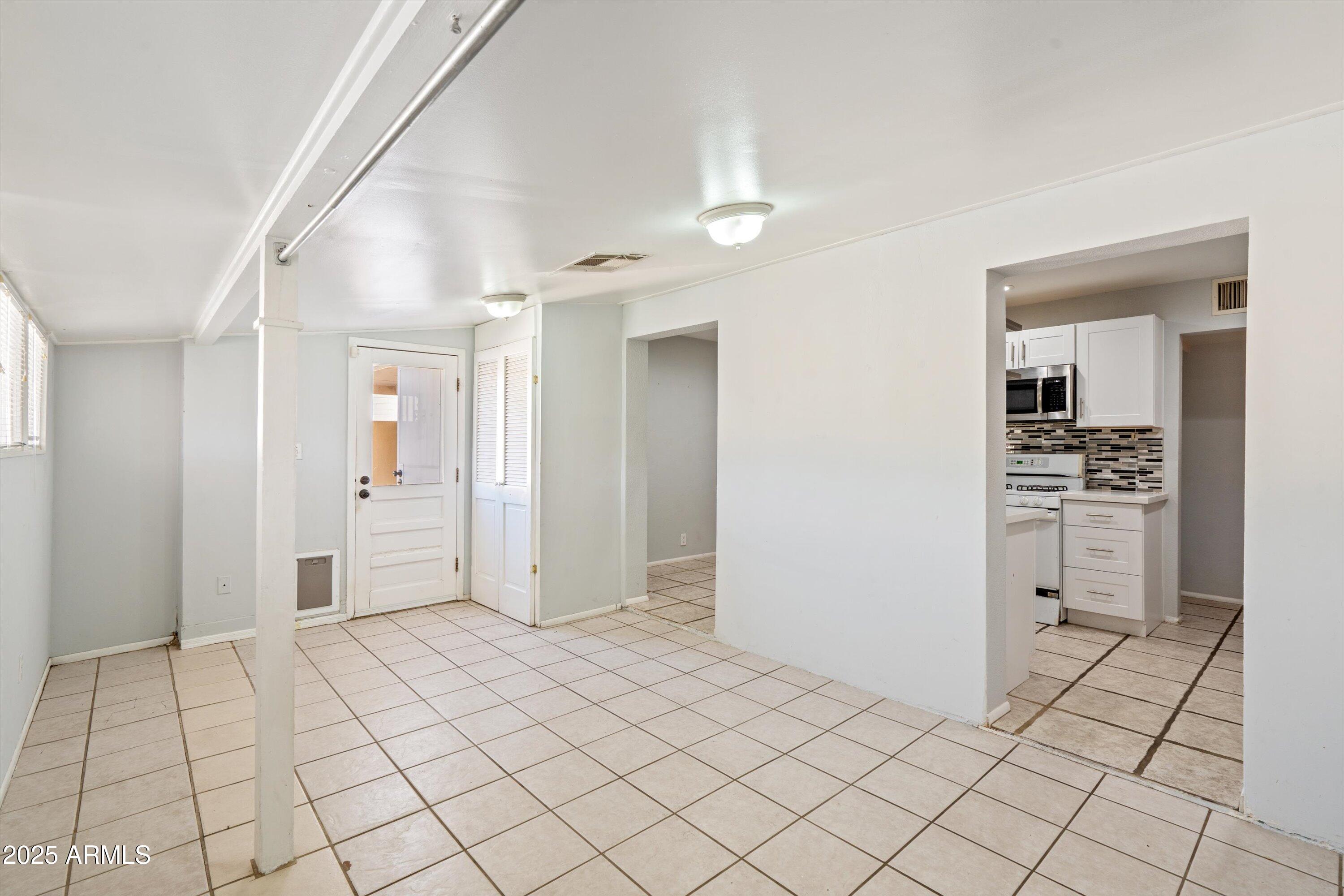 8216 North 9th Street Phoenix, AZ 85020 - Photo 11 of 39 a view of a hallway to closet and natural light