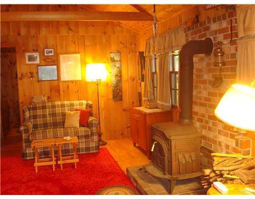 7 Miller Way Stoneham, ME 04088 - Photo 13 of 25 Living Room. Pine interior...