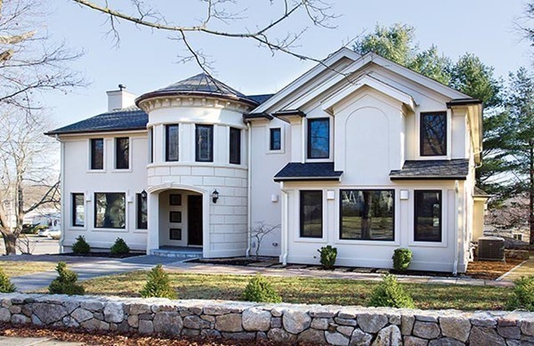 4 Botsford Road Newton, MA 02467 - Photo 3 of 10 a front view of a house with a yard