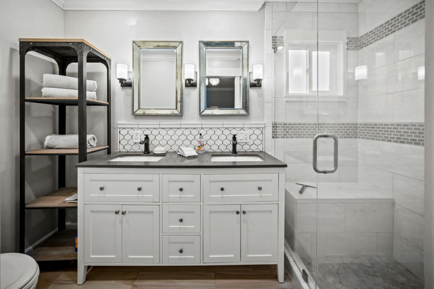 1321 David Avenue Pacific Grove, CA 93950 - Photo 16 of 24 a bathroom with a double vanity sink and a mirror