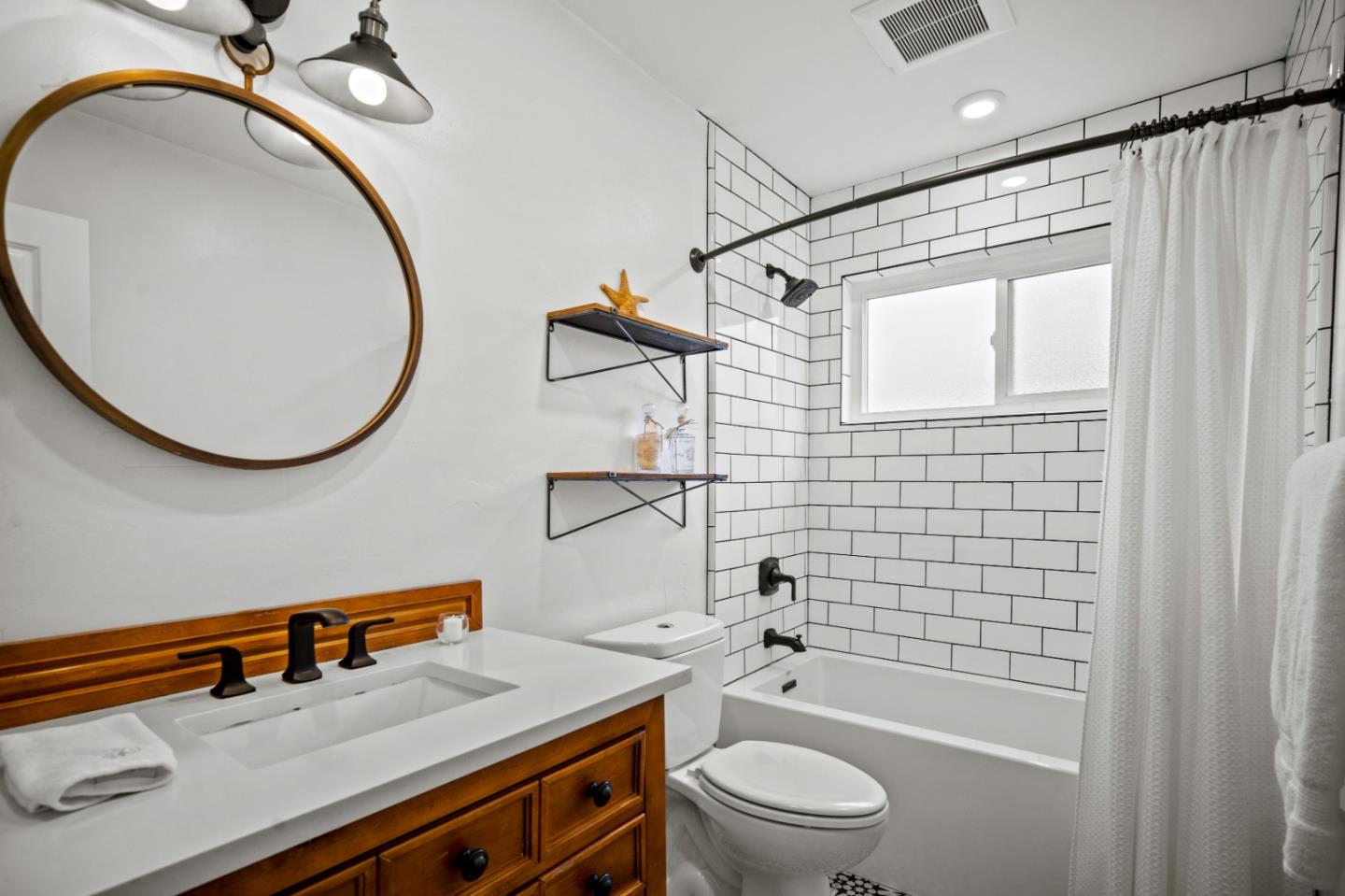 1321 David Avenue Pacific Grove, CA 93950 - Photo 18 of 24 a bathroom with a sink a toilet and shower