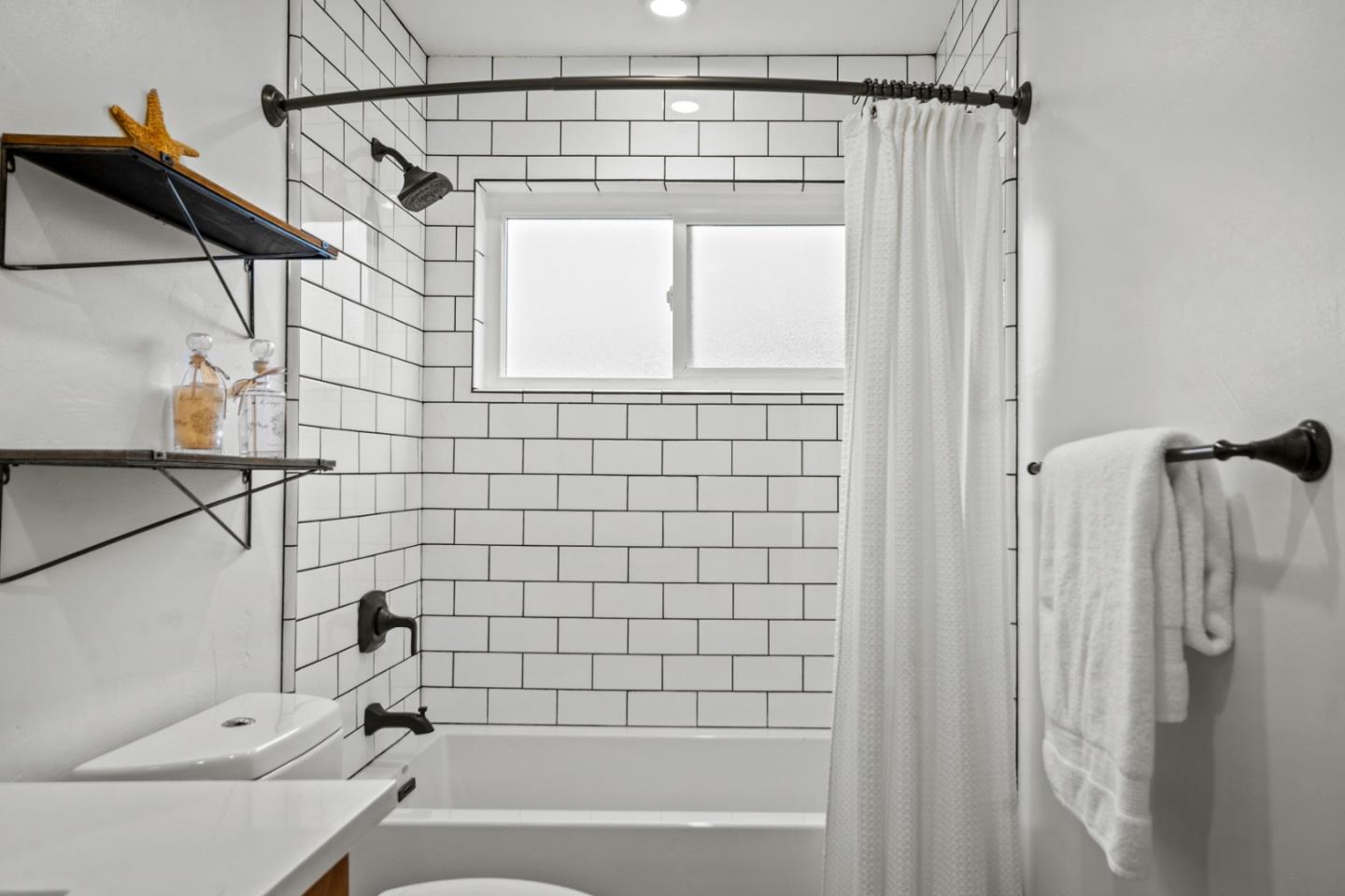 1321 David Avenue Pacific Grove, CA 93950 - Photo 19 of 24 a bathroom with a shower and a bathtub