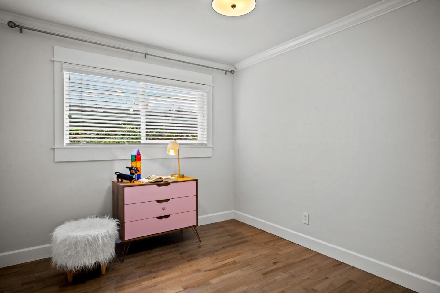 1321 David Avenue Pacific Grove, CA 93950 - Photo 22 of 24 a room with wooden floor and a window