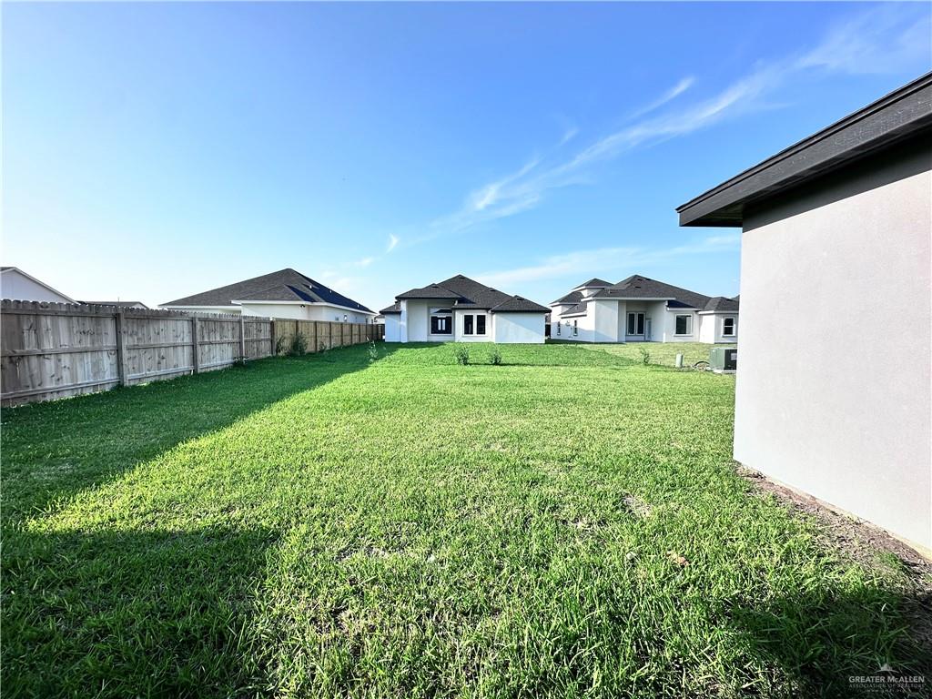 1100 Azalea Street Mission, TX 78573 - Photo 21 of 24 a view of a house with a yard and sitting area