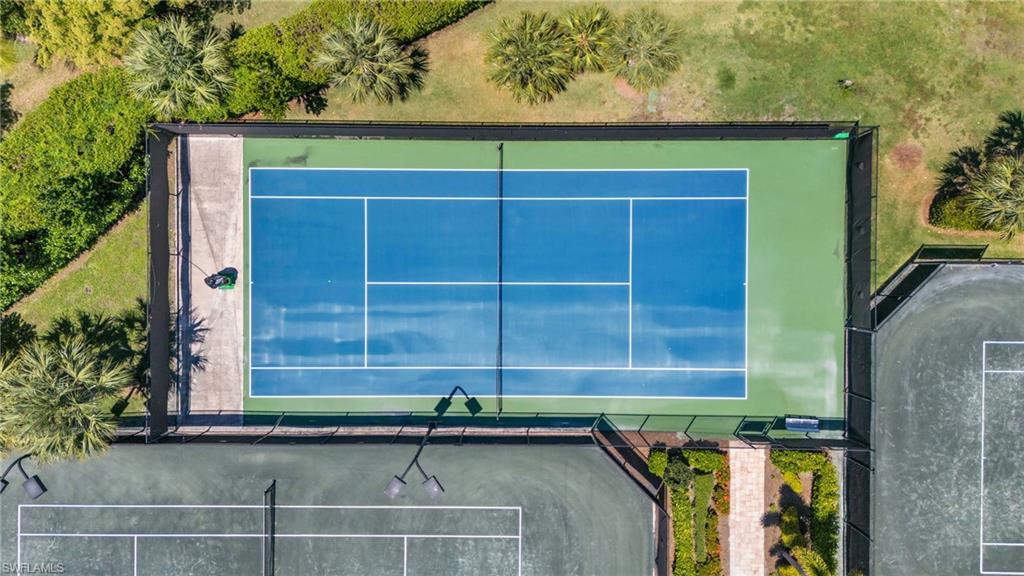 9830 Giaveno Circle, Unit 1646 Naples, FL 34113 - Photo 28 of 30 a small white building with a outdoor space