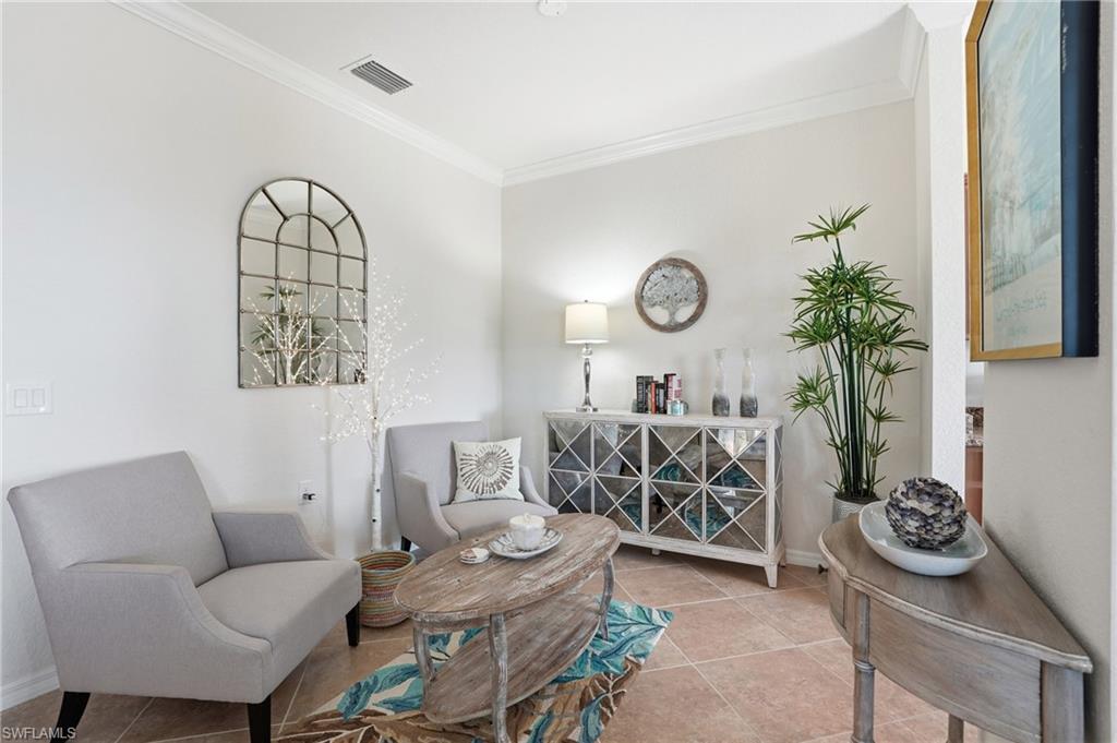 9830 Giaveno Circle, Unit 1646 Naples, FL 34113 - Photo 6 of 30 a living room with furniture
