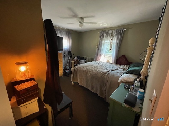7-9 Cook Street Ansonia, CT 06401 - Photo 11 of 17 a bedroom with a bed and a lamp