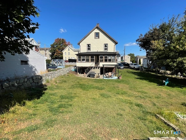 7-9 Cook Street Ansonia, CT 06401 - Photo 4 of 17 a view of house with garden space and car parked