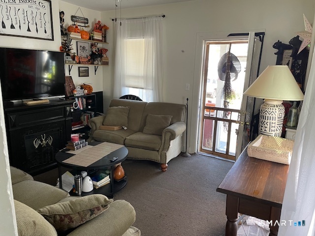 7-9 Cook Street Ansonia, CT 06401 - Photo 6 of 17 a living room with furniture a flat screen tv and a window