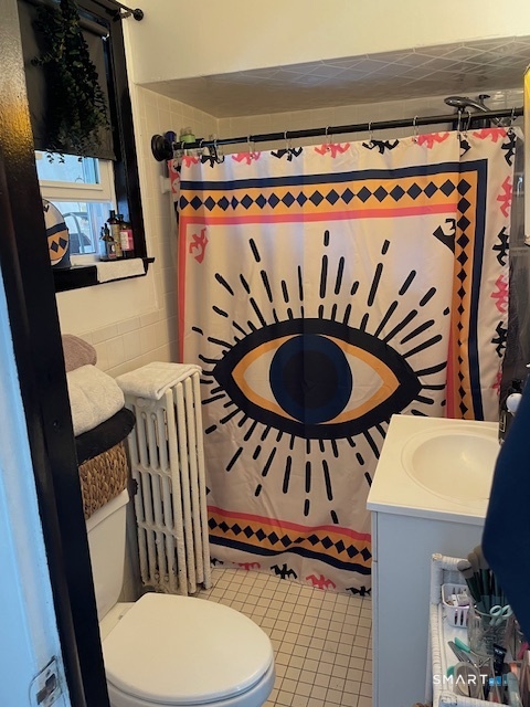 7-9 Cook Street Ansonia, CT 06401 - Photo 9 of 17 a bathroom with a toilet a sink and a mirror