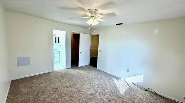 a bathroom with a toilet sink and a mirror