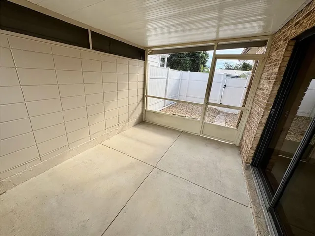 a patio with table and chairs