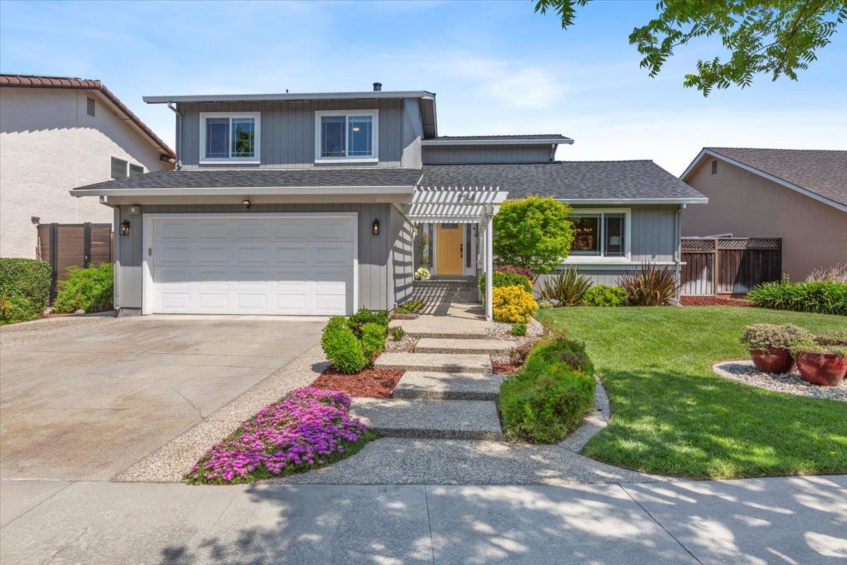 a front view of a house with garden