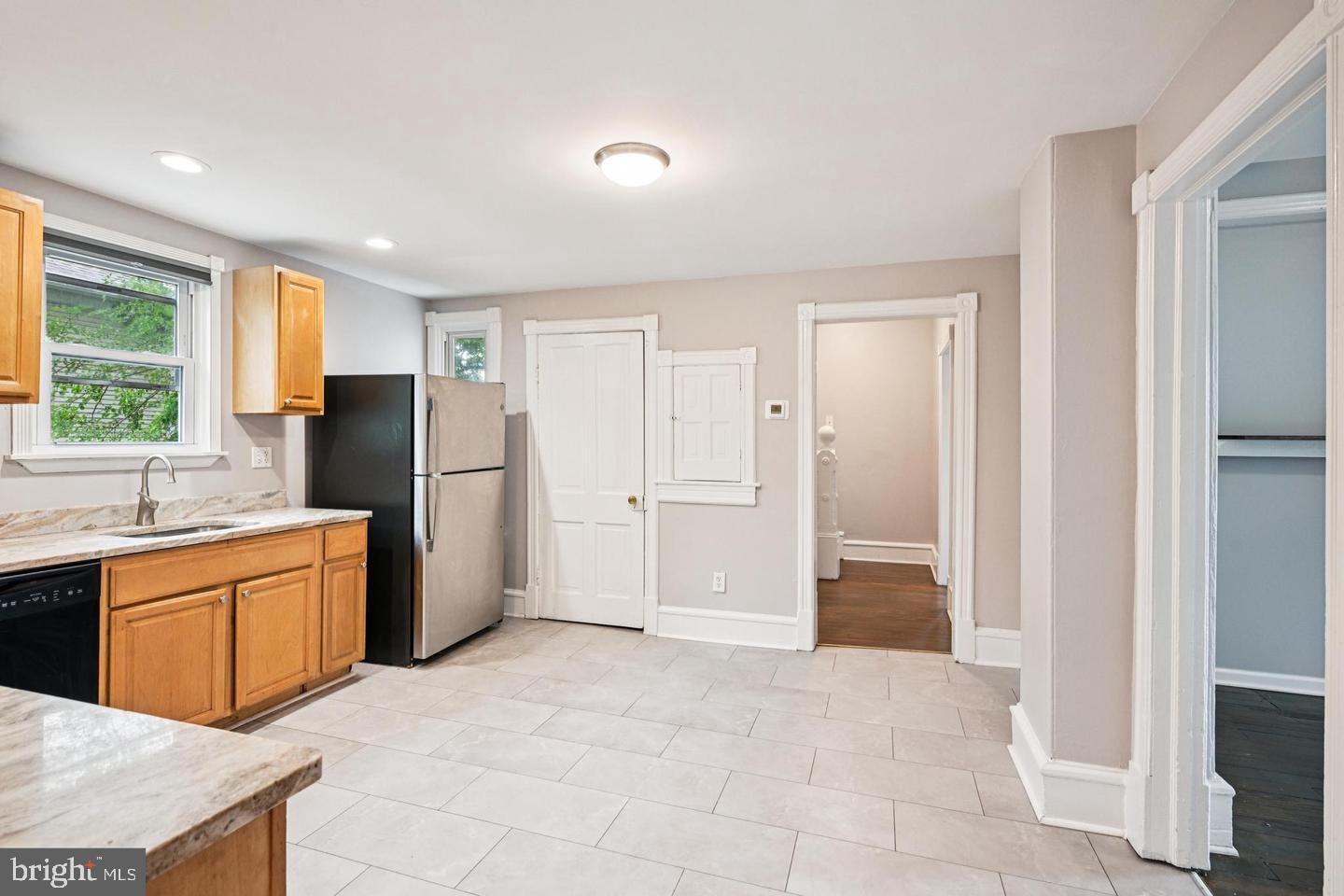 134 South Main Street Glassboro, NJ 08028 - Photo 3 of 6 a large kitchen with stainless steel appliances granite countertop a refrigerator and a sink