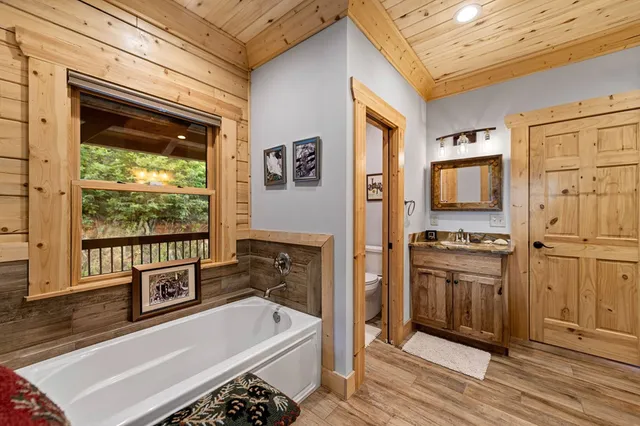 a living room with furniture fireplace and a flat screen tv