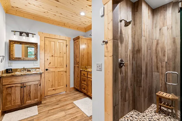 a bedroom with furniture and wooden floor