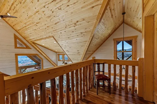 a aerial view of a house with a yard and balcony